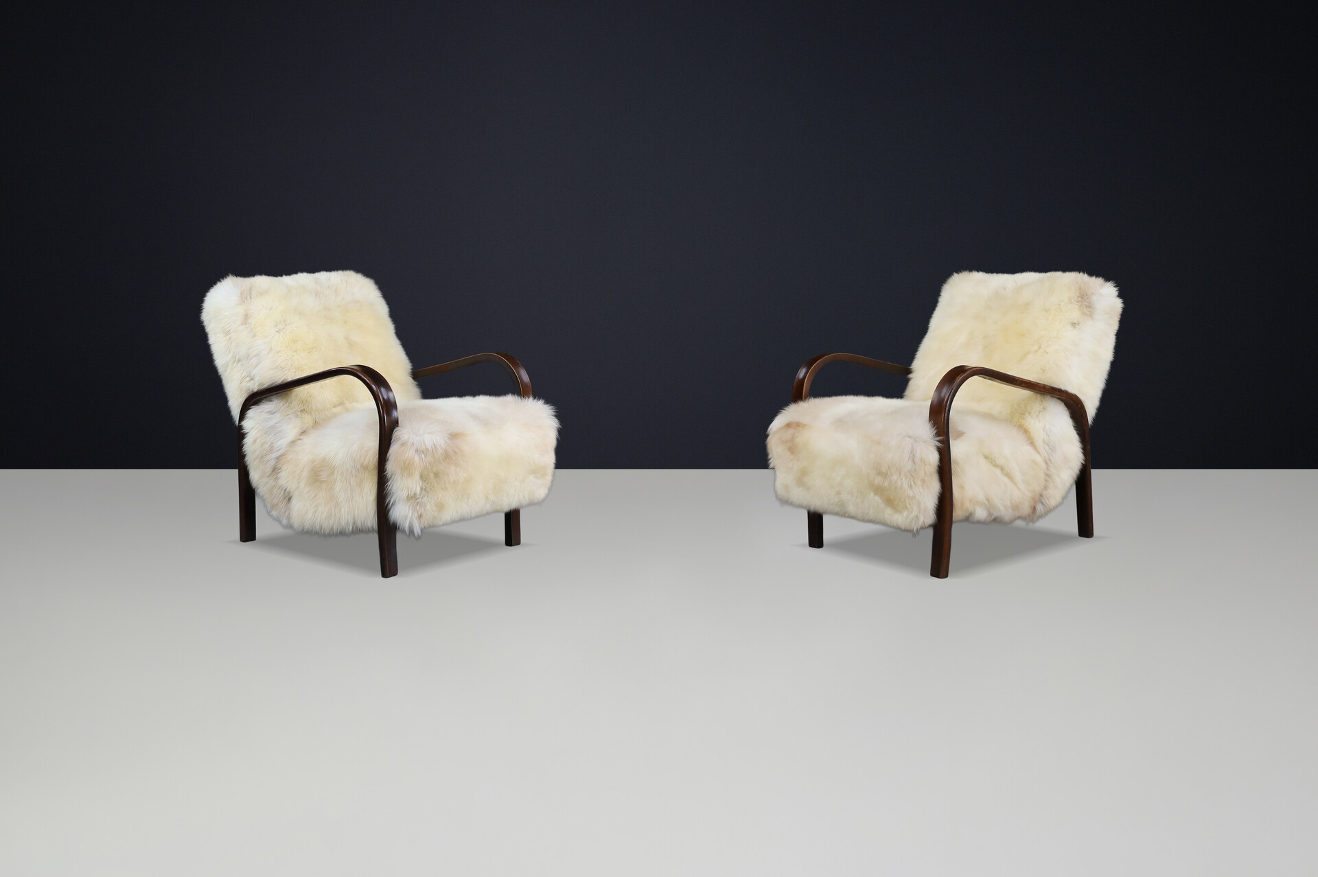 1940s Kozelka & Kropacek Armchairs in Texel Sheepskin & Dark Patinated Frame Mid-20th century