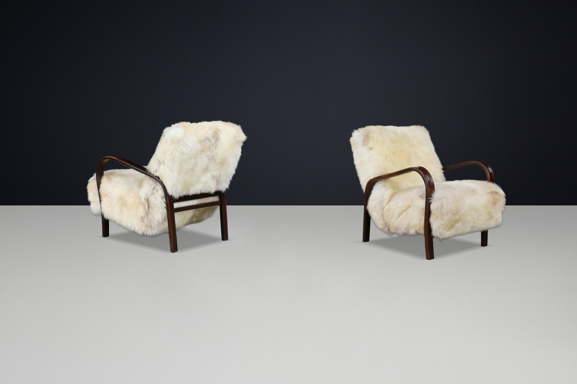 1940s Kozelka & Kropacek Armchairs in Texel Sheepskin & Dark Patinated Frame Mid-20th century
