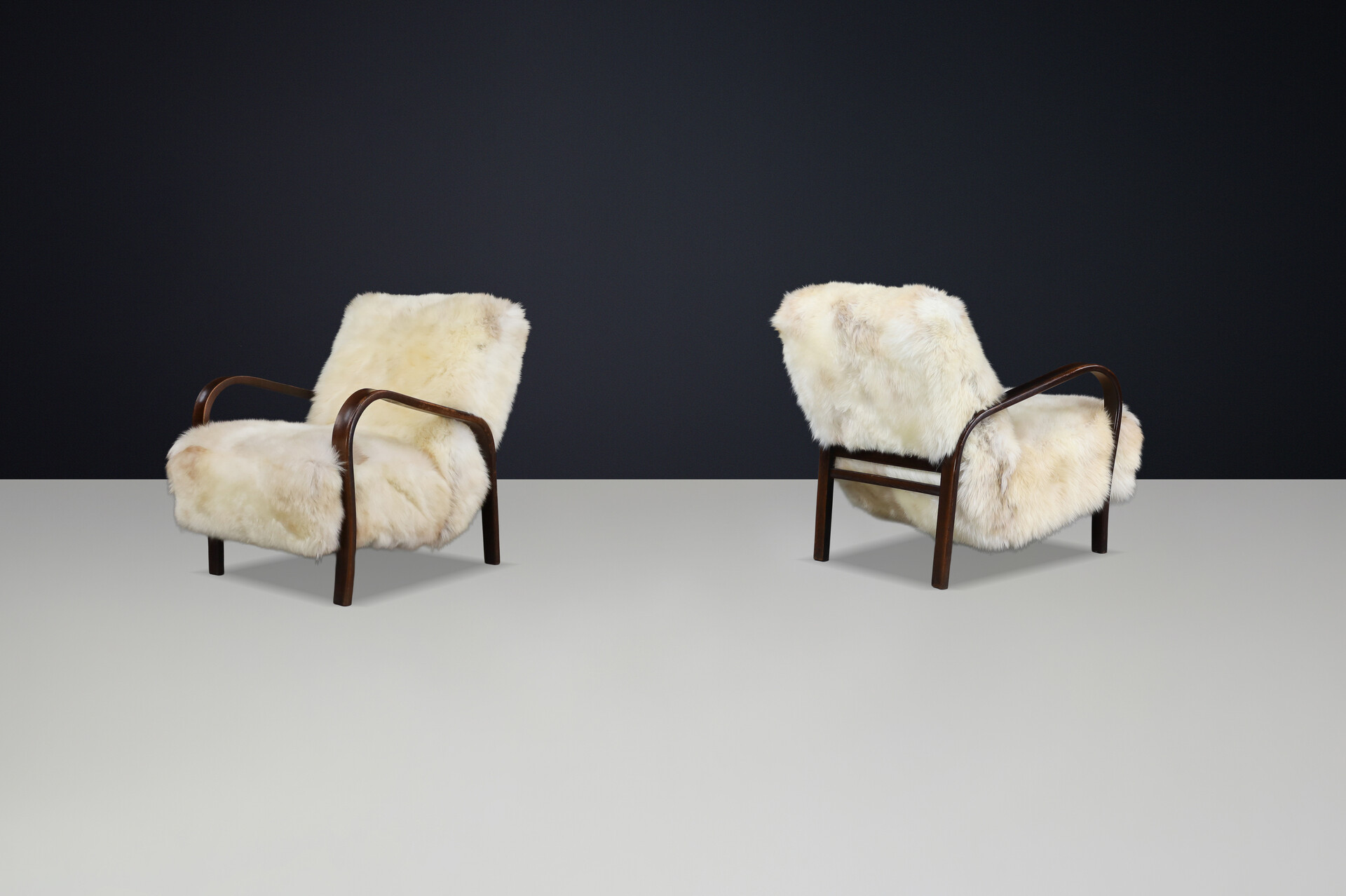 1940s Kozelka & Kropacek Armchairs in Texel Sheepskin & Dark Patinated Frame Mid-20th century