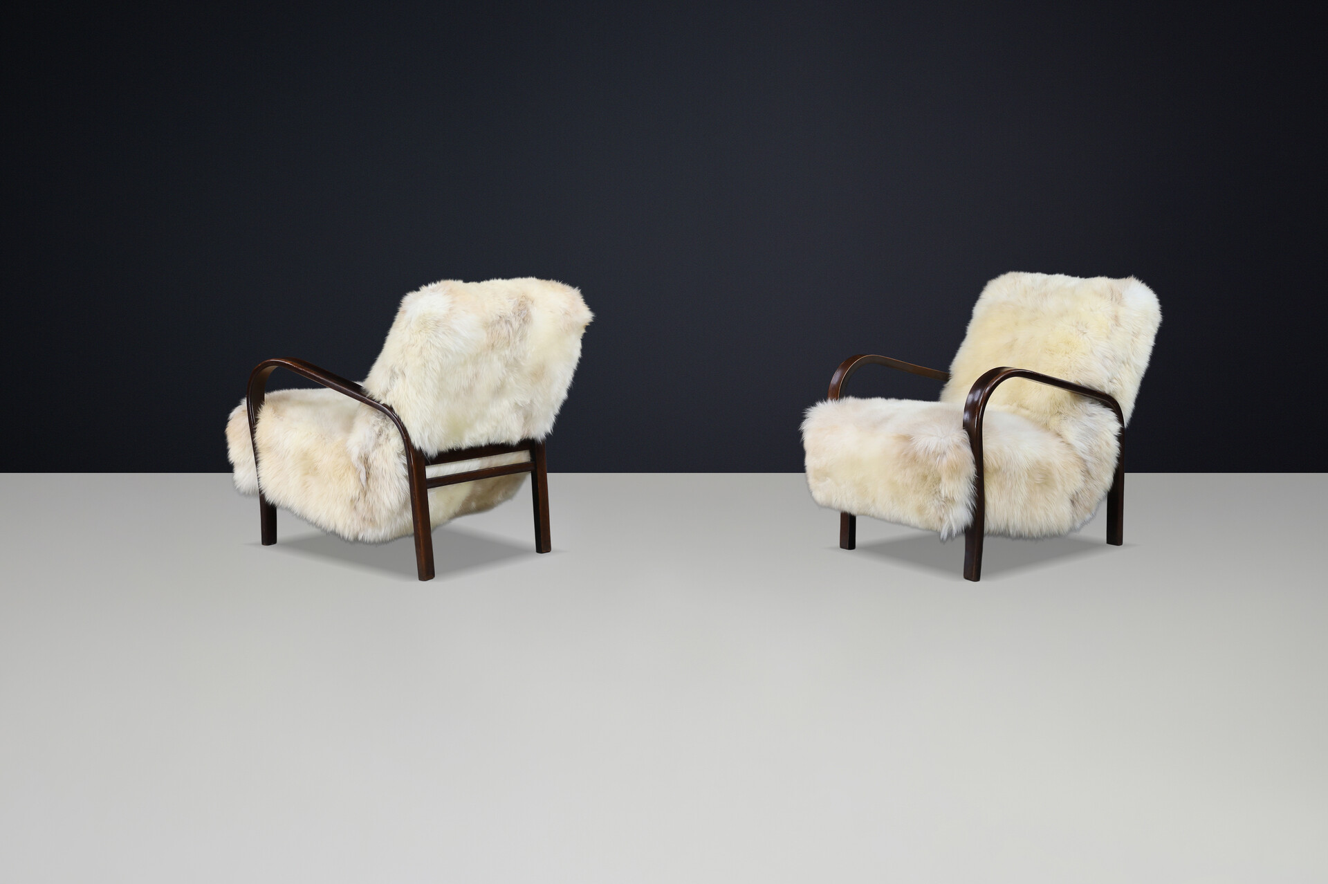 1940s Kozelka & Kropacek Armchairs in Texel Sheepskin & Dark Patinated Frame Mid-20th century