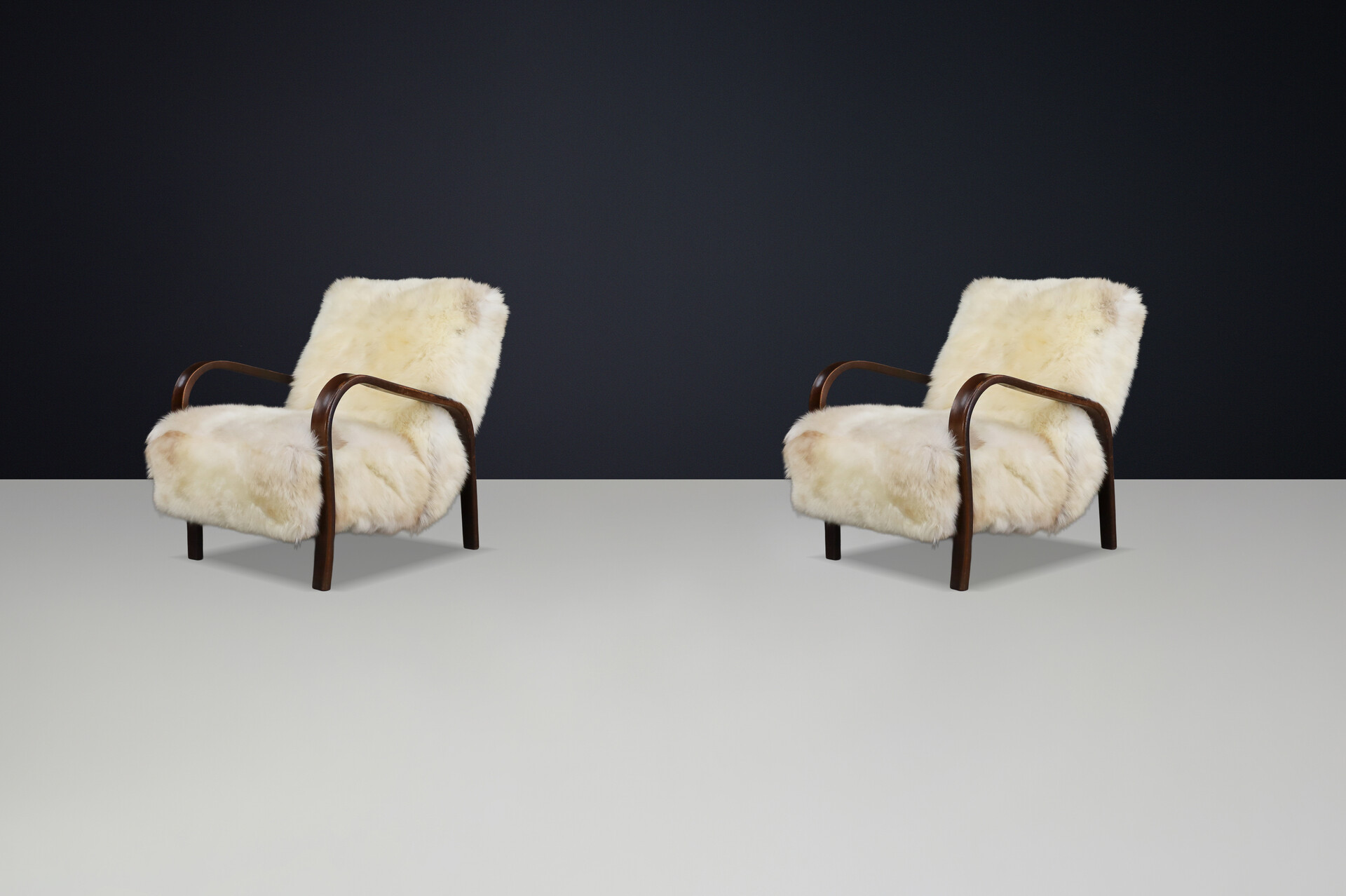 1940s Kozelka & Kropacek Armchairs in Texel Sheepskin & Dark Patinated Frame Mid-20th century