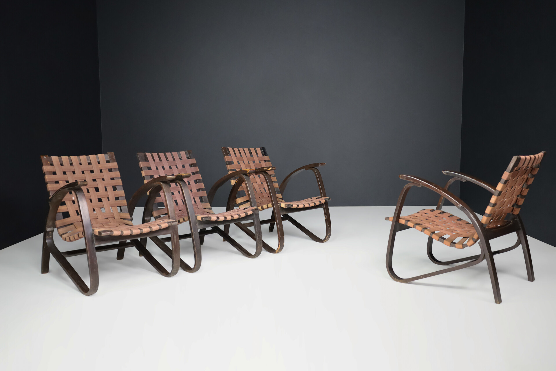 Bauhaus Lounge chairs in dark bentwood and woven straps by Jan Vanek, Czech Republic, 1930s. Mid-20th century