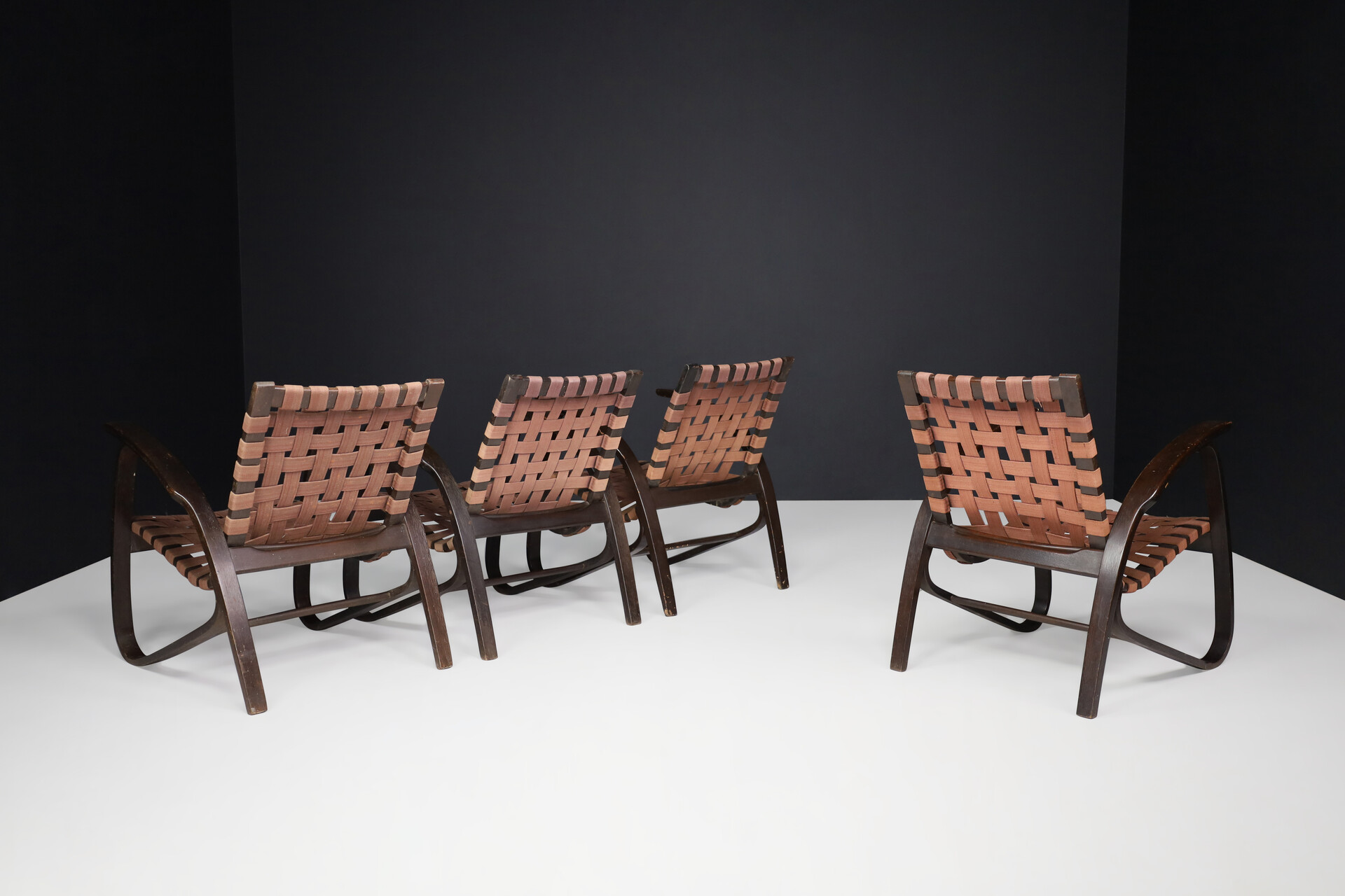 Bauhaus Lounge chairs in dark bentwood and woven straps by Jan Vanek, Czech Republic, 1930s. Mid-20th century
