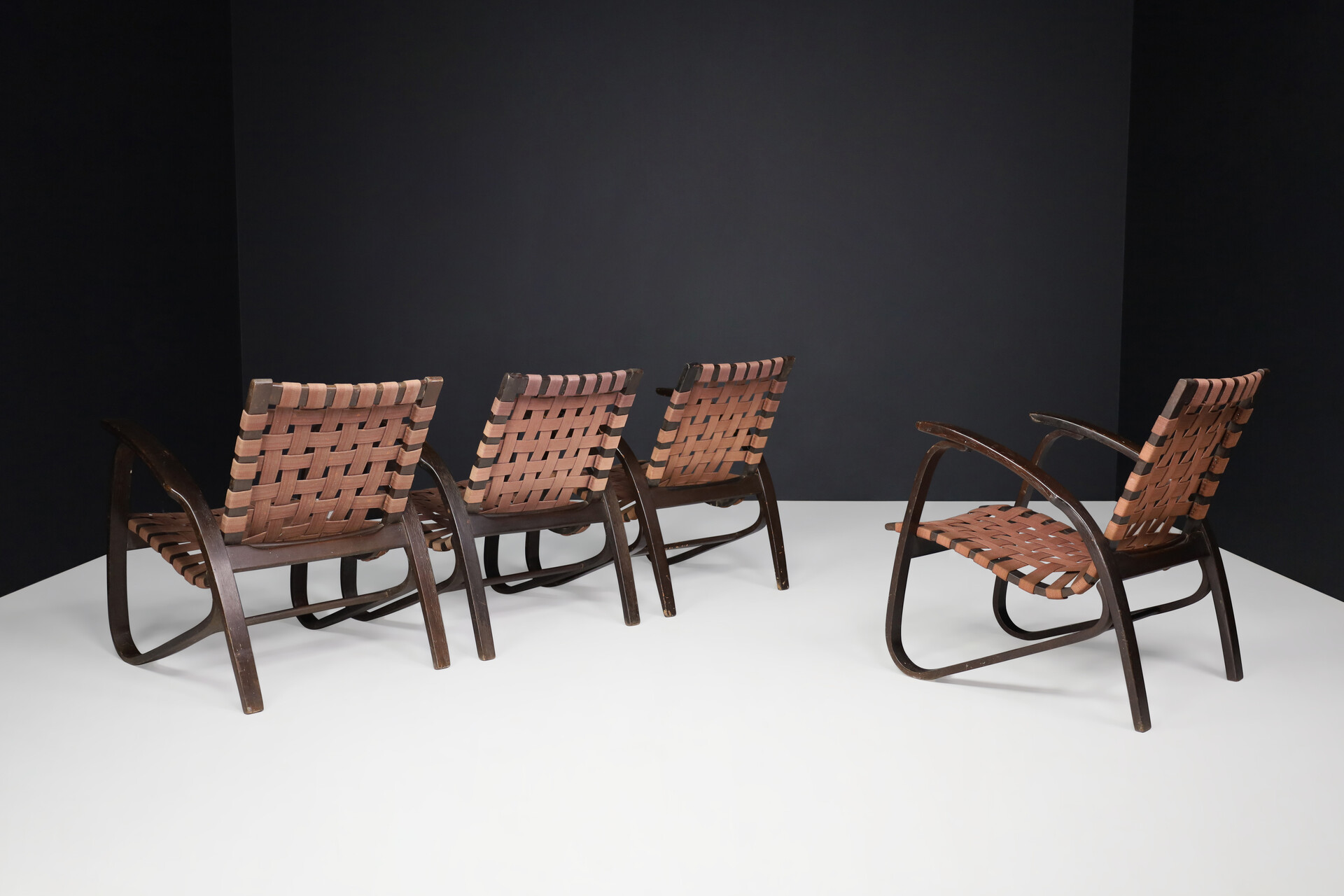 Bauhaus Lounge chairs in dark bentwood and woven straps by Jan Vanek, Czech Republic, 1930s. Mid-20th century