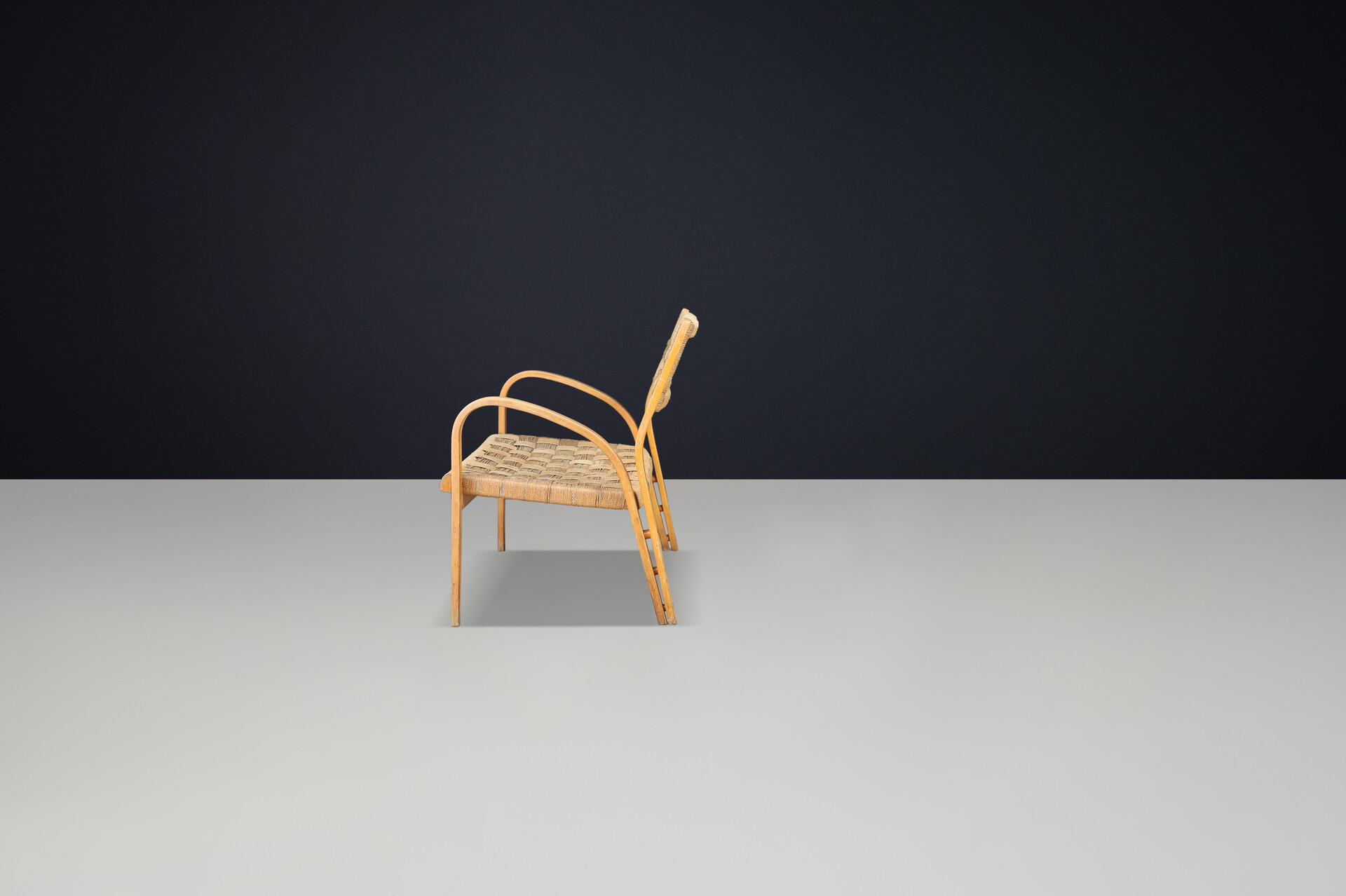 Bench by Augusto Romano, Italy, 1940s.  Bent plywood with braided rope with wonderful patina and curved shape. Mid-20th century