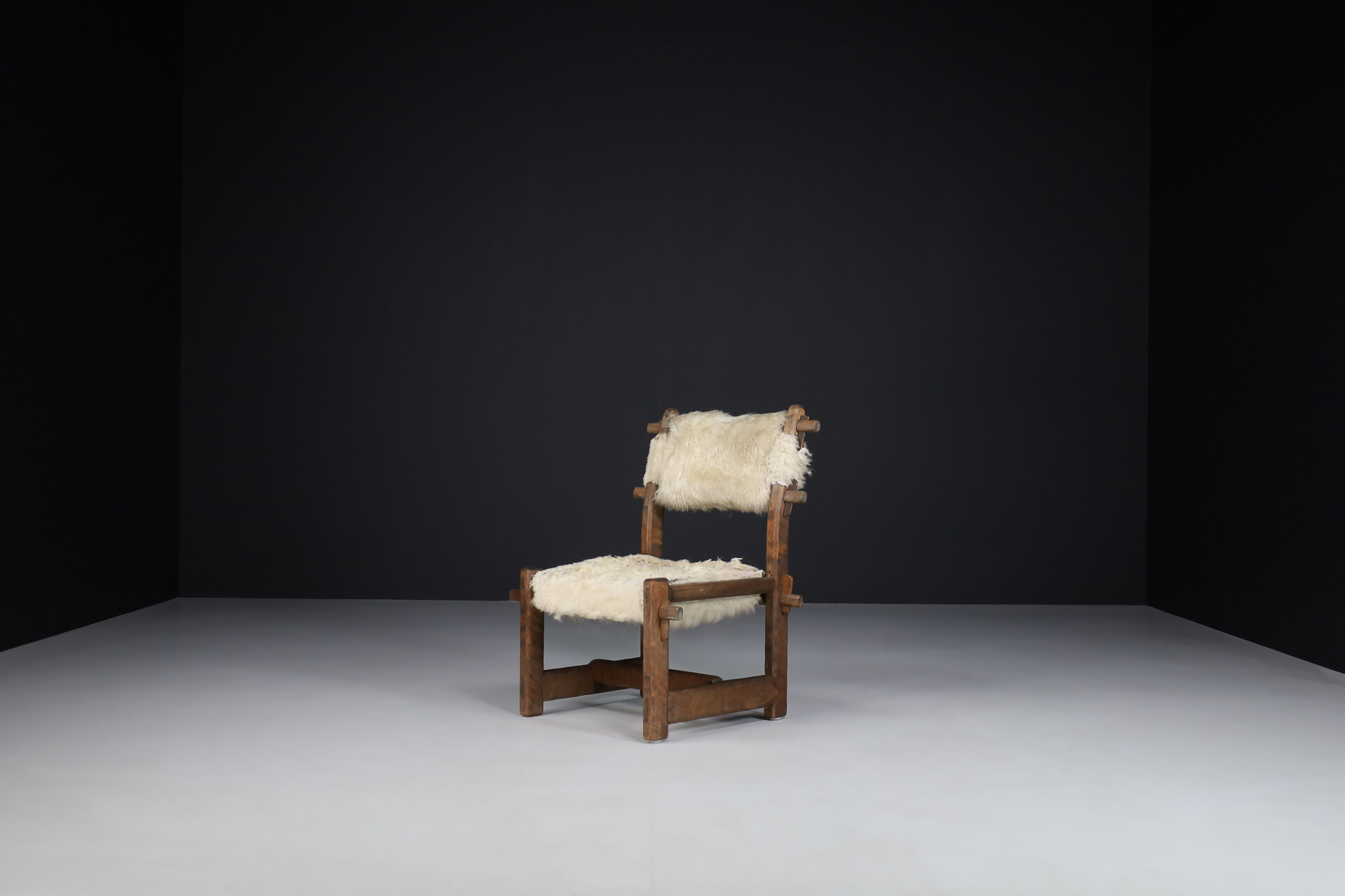 Brutalist Primitive oak side chair with lamswool fur , France 1950s Mid-20th century