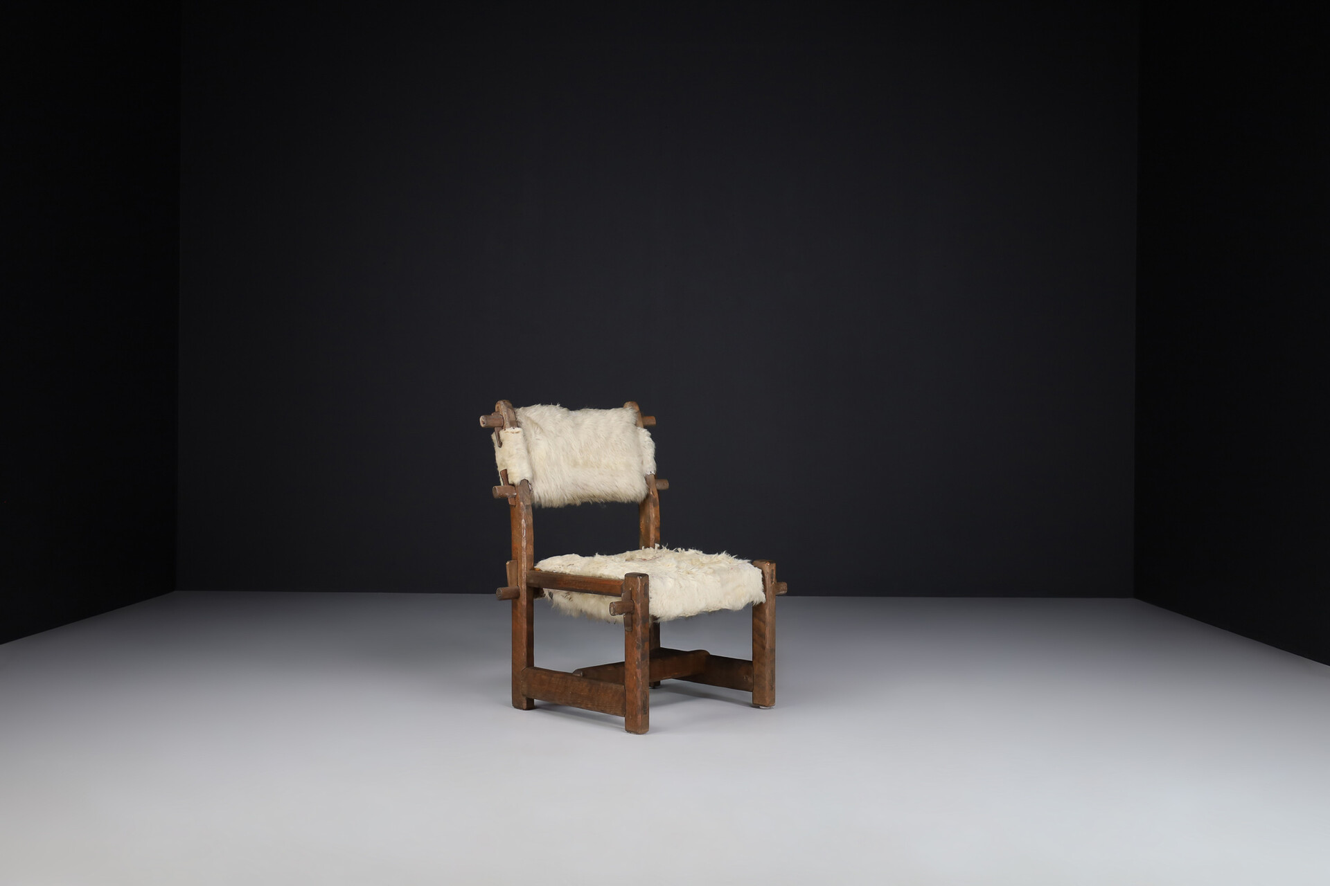 Brutalist Primitive oak side chair with lamswool fur , France 1950s Mid-20th century