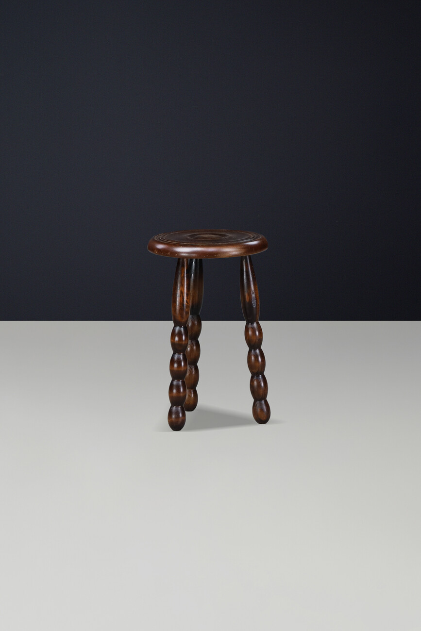 Brutalist Sculptural pair of French Brutalist stools crafted in solid walnut, designed in the manner of Charles Dudouyt, France, circa 1940s. Mid-20th century