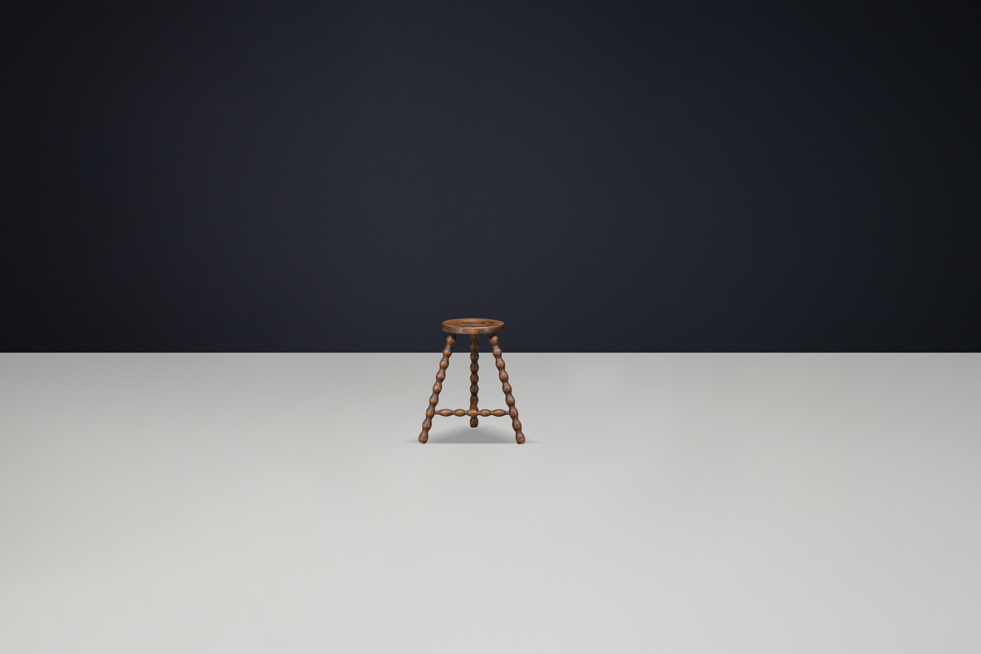 Brutalist Walnut stool with turned legs t-stretcher and incised seat design, in the style of Charles Duduoyt, France 1950's. Mid-20th century