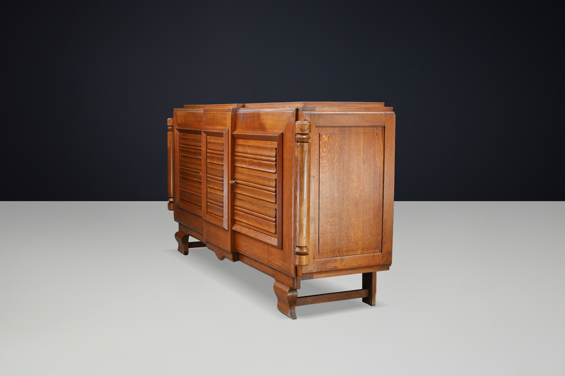 French Art Deco Patinated Oak Sideboard with Relief Carved Doors, 1940s Early-20th century