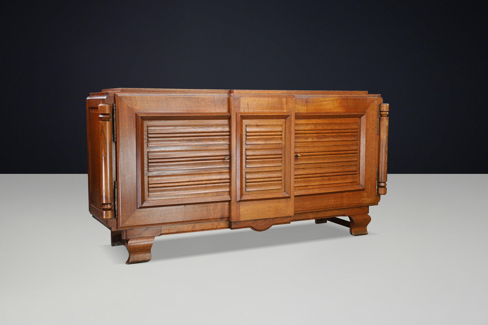 French Art Deco Patinated Oak Sideboard with Relief Carved Doors, 1940s Early-20th century