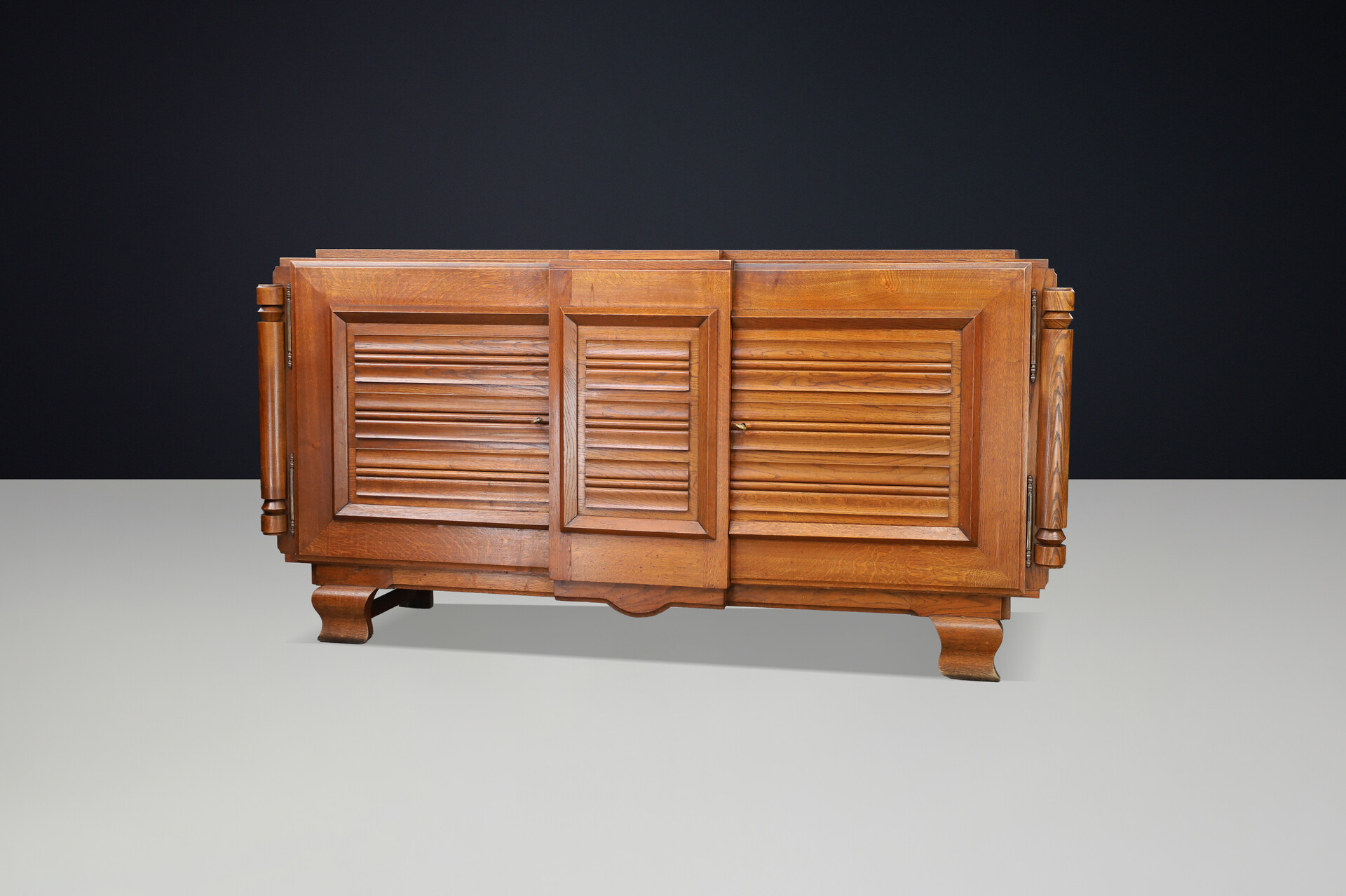 French Art Deco Patinated Oak Sideboard with Relief Carved Doors, 1940s Early-20th century