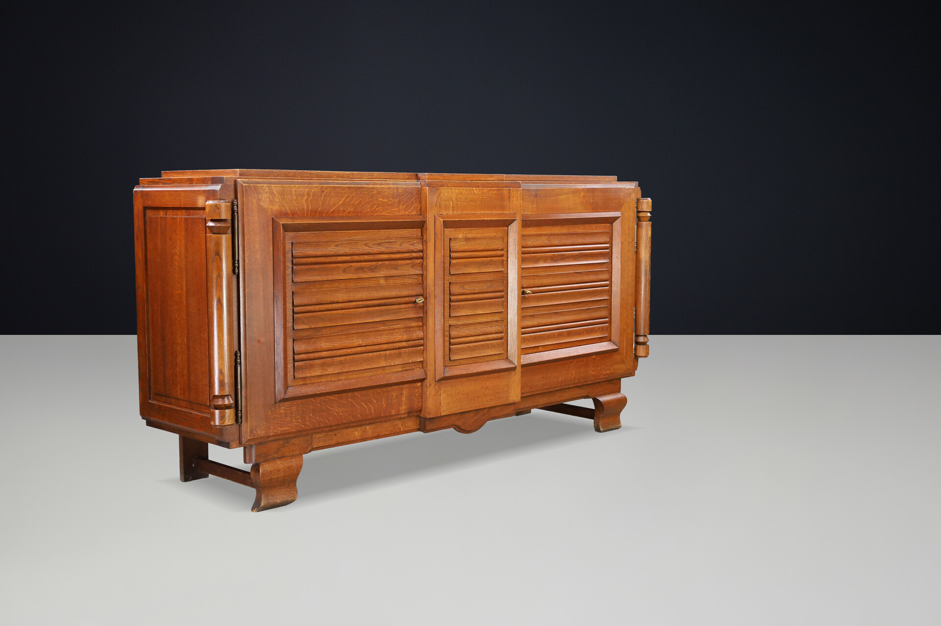 French Art Deco Patinated Oak Sideboard with Relief Carved Doors, 1940s Early-20th century