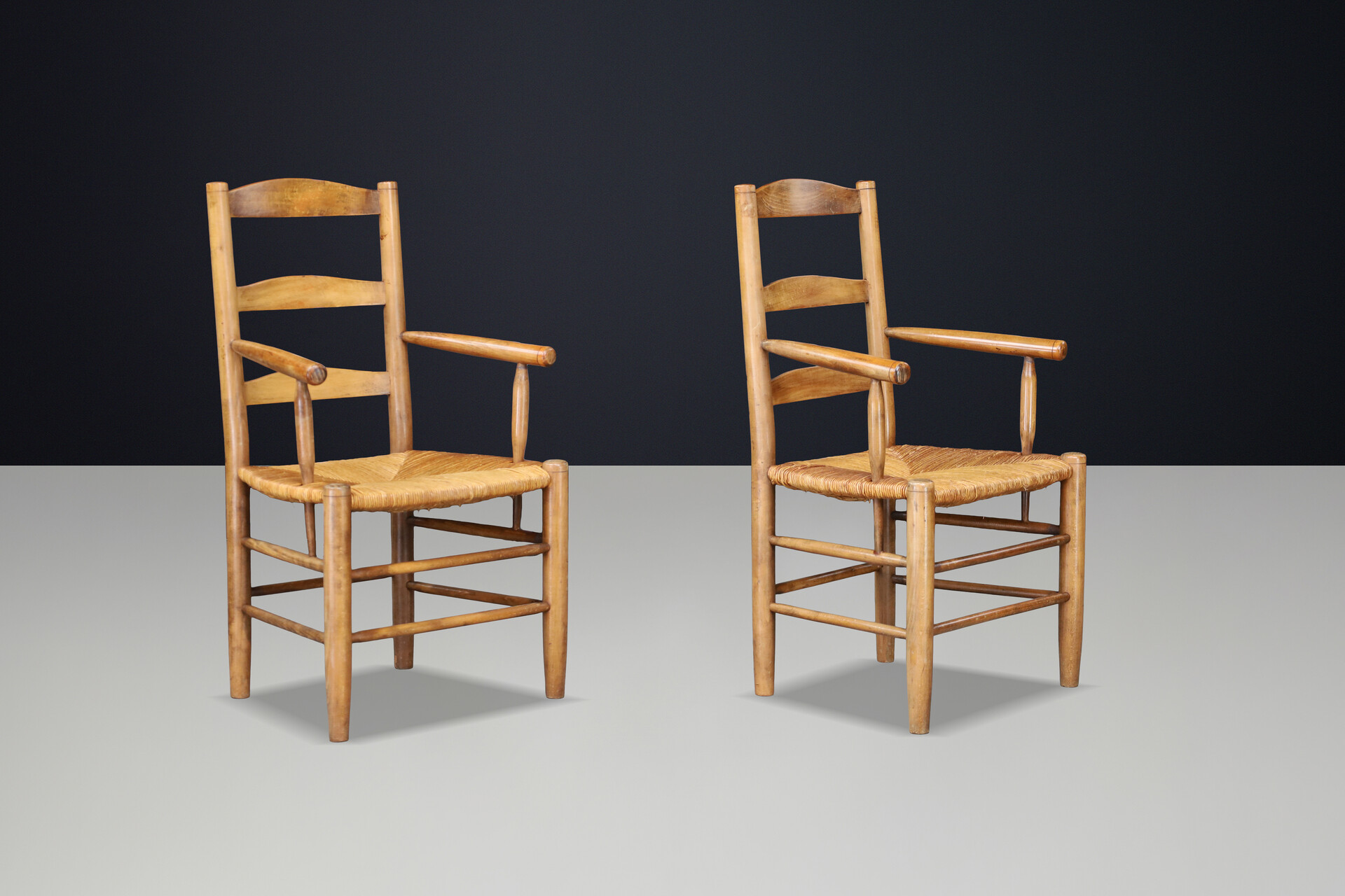 French Oak Armchairs with Rush Seats in the Style of Charlotte Perriand, France 1950s Mid-20th century
