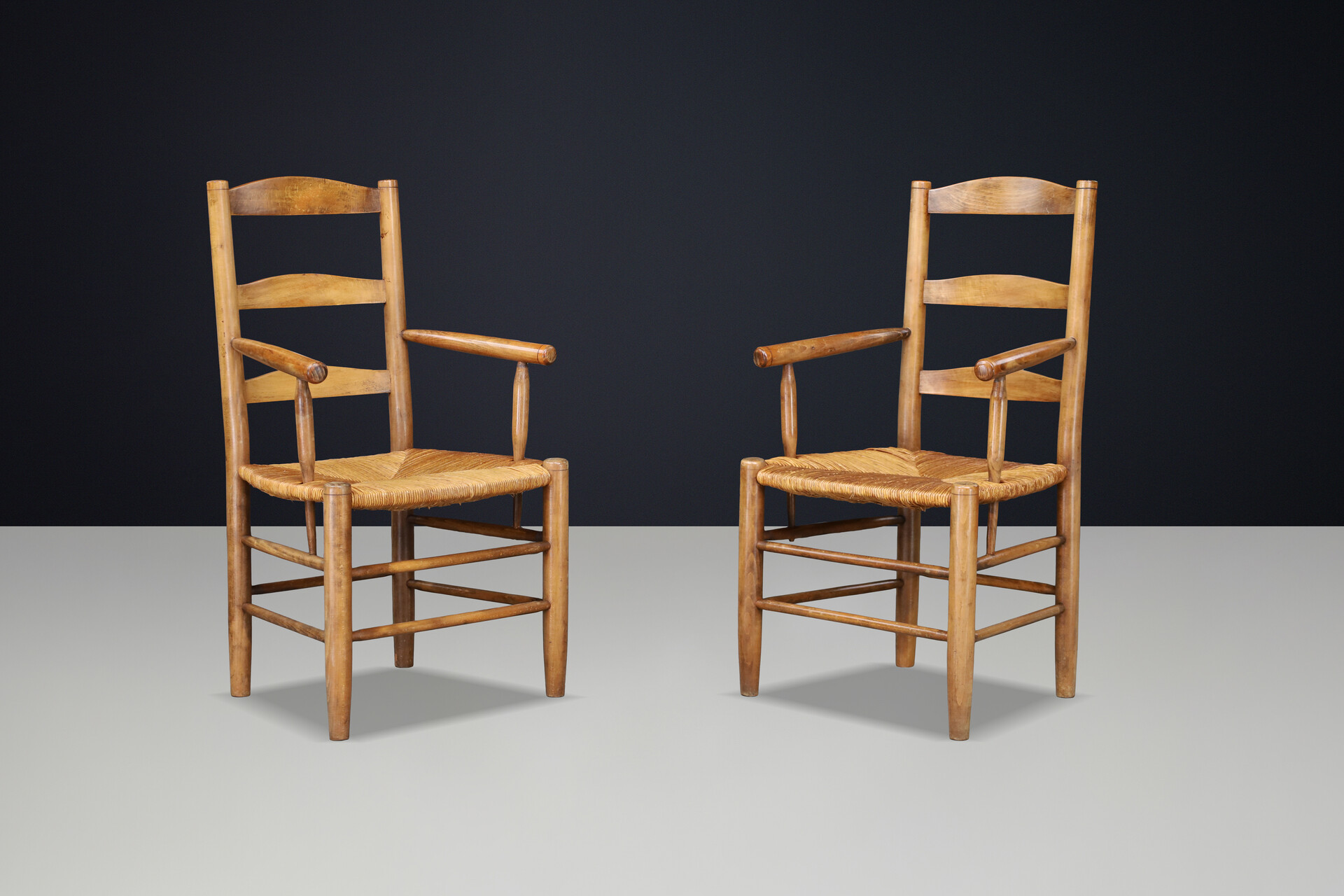 French Oak Armchairs with Rush Seats in the Style of Charlotte Perriand, France 1950s Mid-20th century