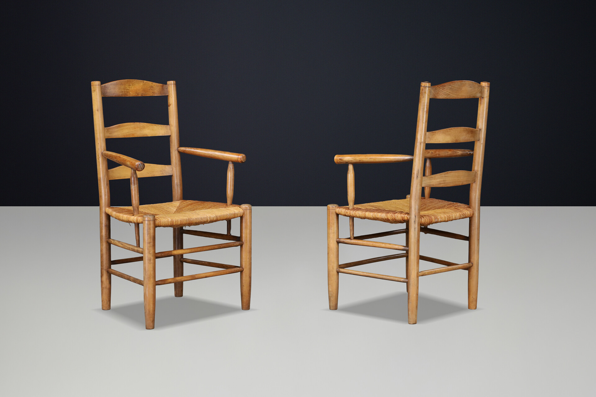 French Oak Armchairs with Rush Seats in the Style of Charlotte Perriand, France 1950s Mid-20th century