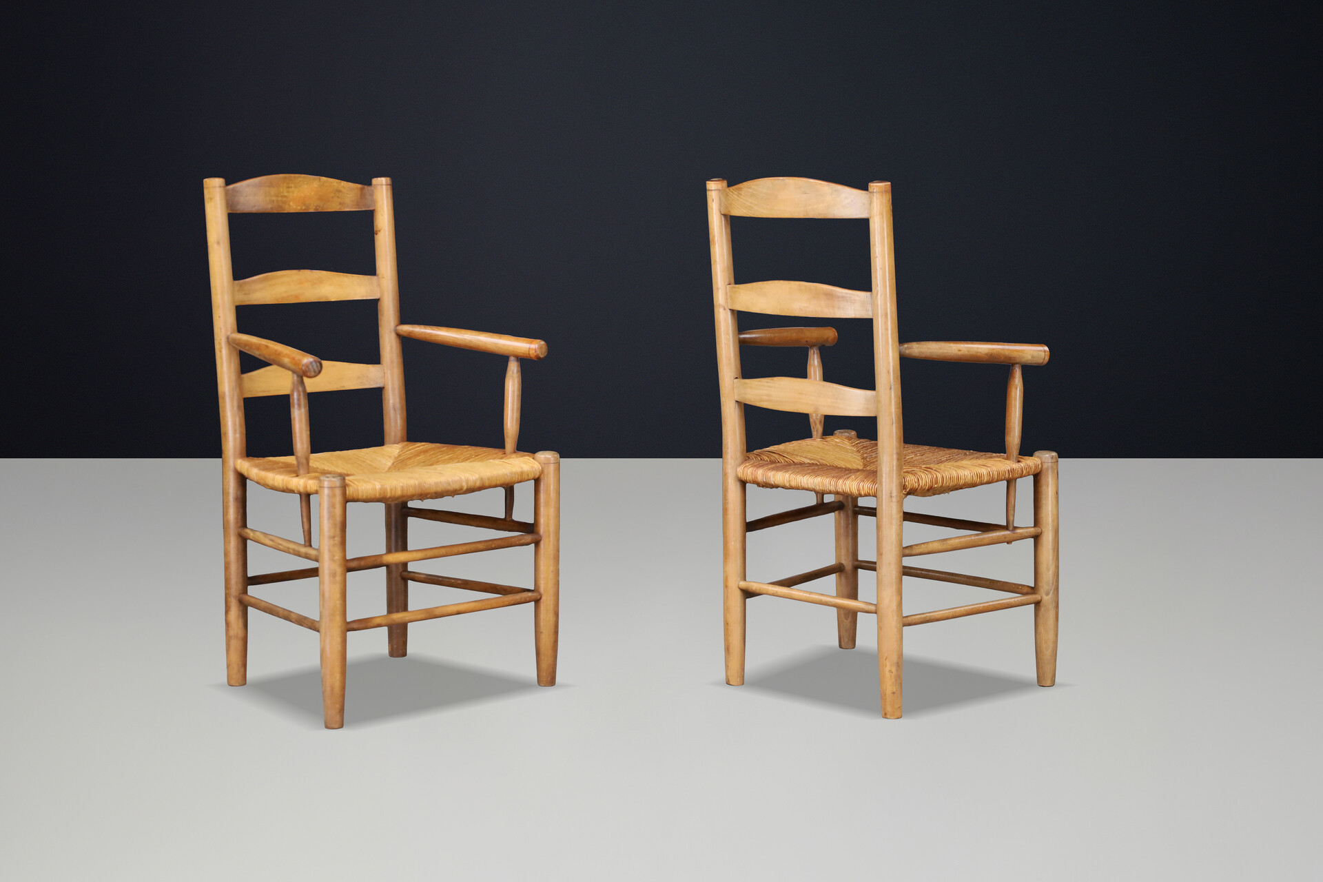 French Oak Armchairs with Rush Seats in the Style of Charlotte Perriand, France 1950s Mid-20th century