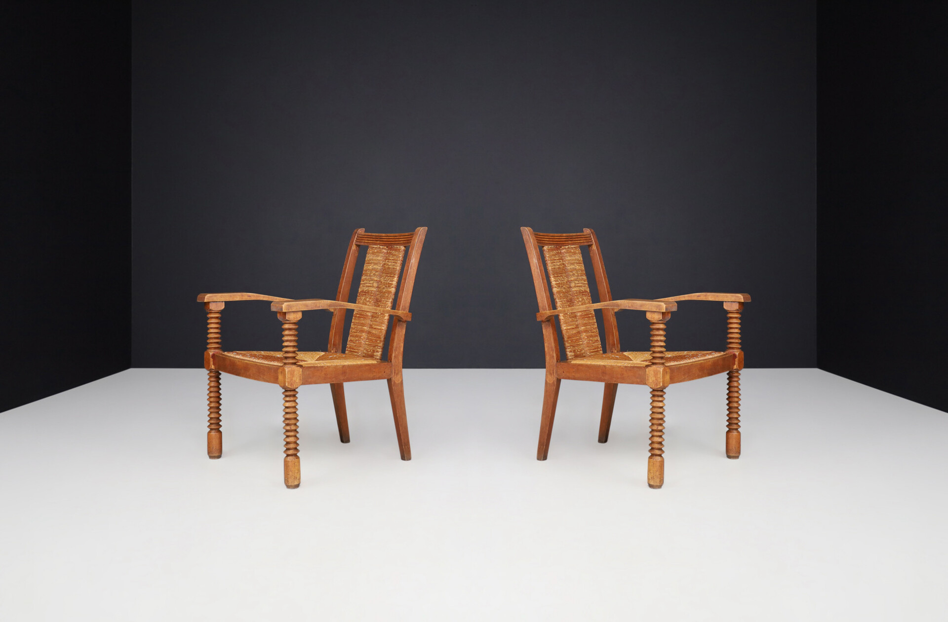 French provincial Charles Dudouyt Patinated Oak and Rush Armchairs, France 1940s Mid-20th century