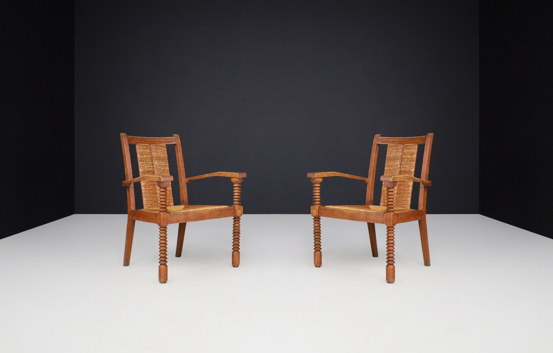French provincial Charles Dudouyt Patinated Oak and Rush Armchairs, France 1940s Mid-20th century