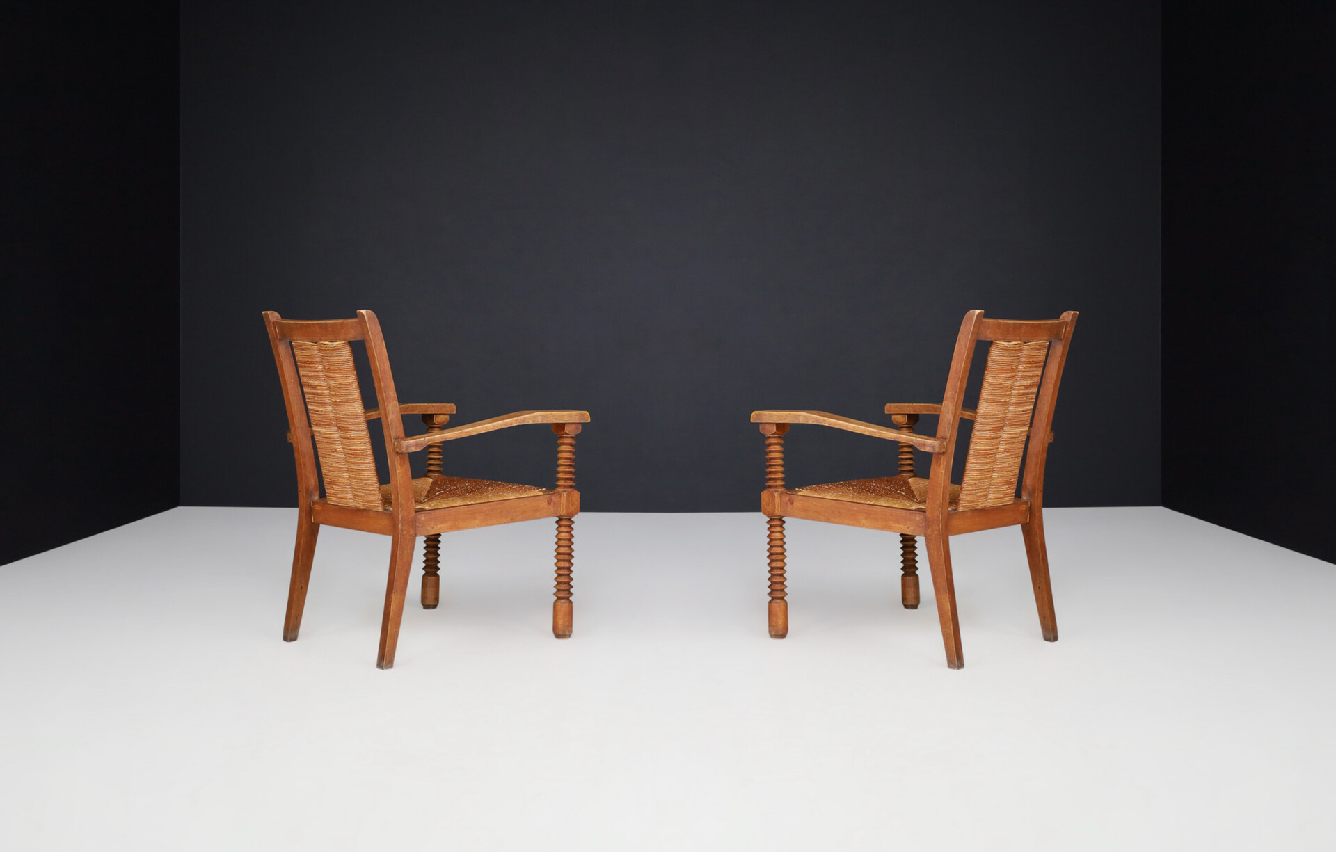 French provincial Charles Dudouyt Patinated Oak and Rush Armchairs, France 1940s Mid-20th century