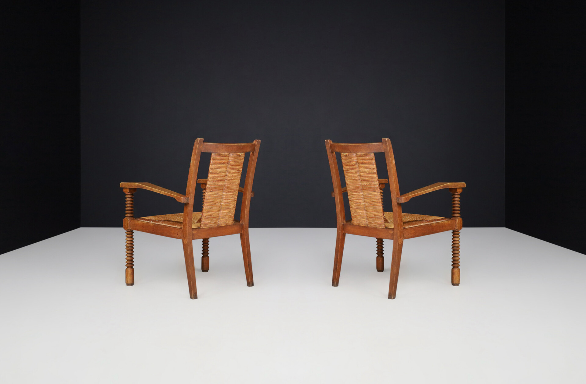 French provincial Charles Dudouyt Patinated Oak and Rush Armchairs, France 1940s Mid-20th century