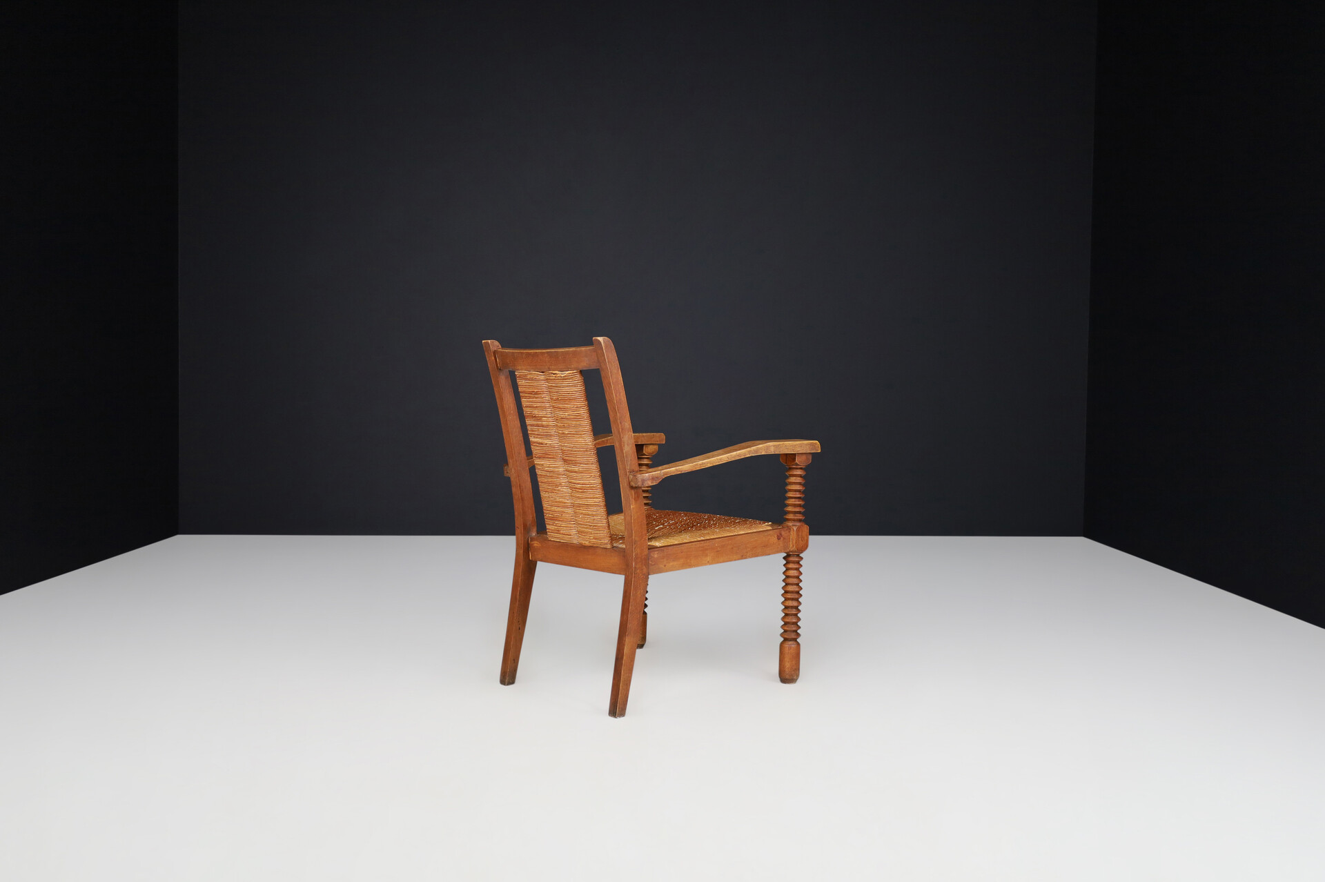 French provincial Charles Dudouyt Patinated Oak and Rush Armchairs, France 1940s Mid-20th century