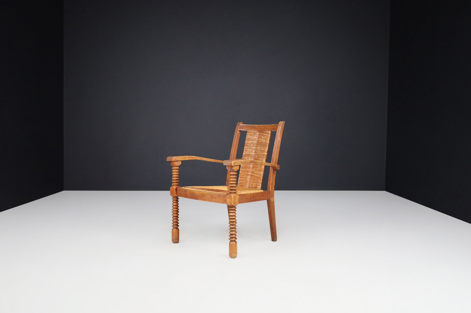 French provincial Charles Dudouyt Patinated Oak and Rush Armchairs, France 1940s Mid-20th century