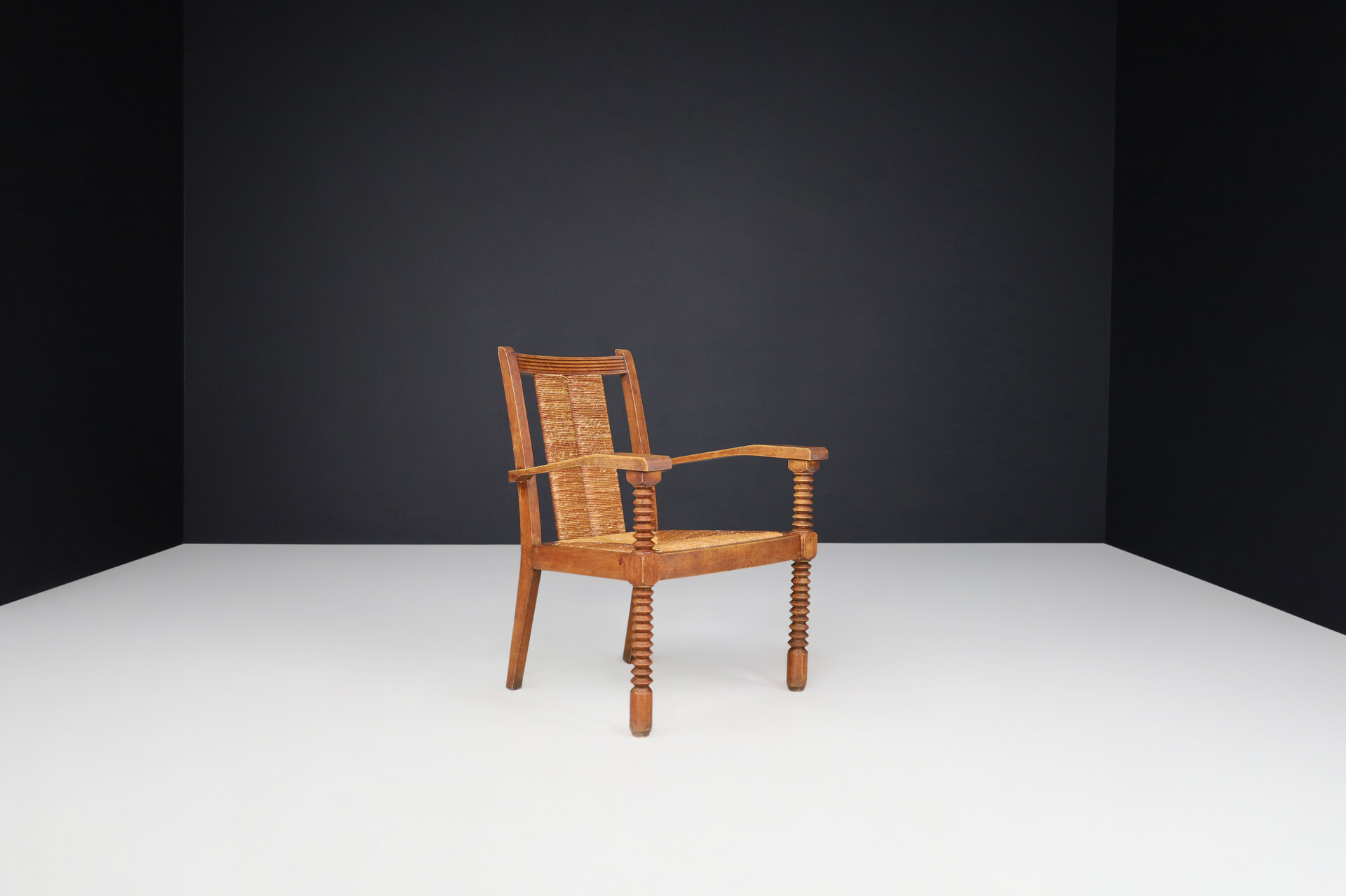 French provincial Charles Dudouyt Patinated Oak and Rush Armchairs, France 1940s Mid-20th century
