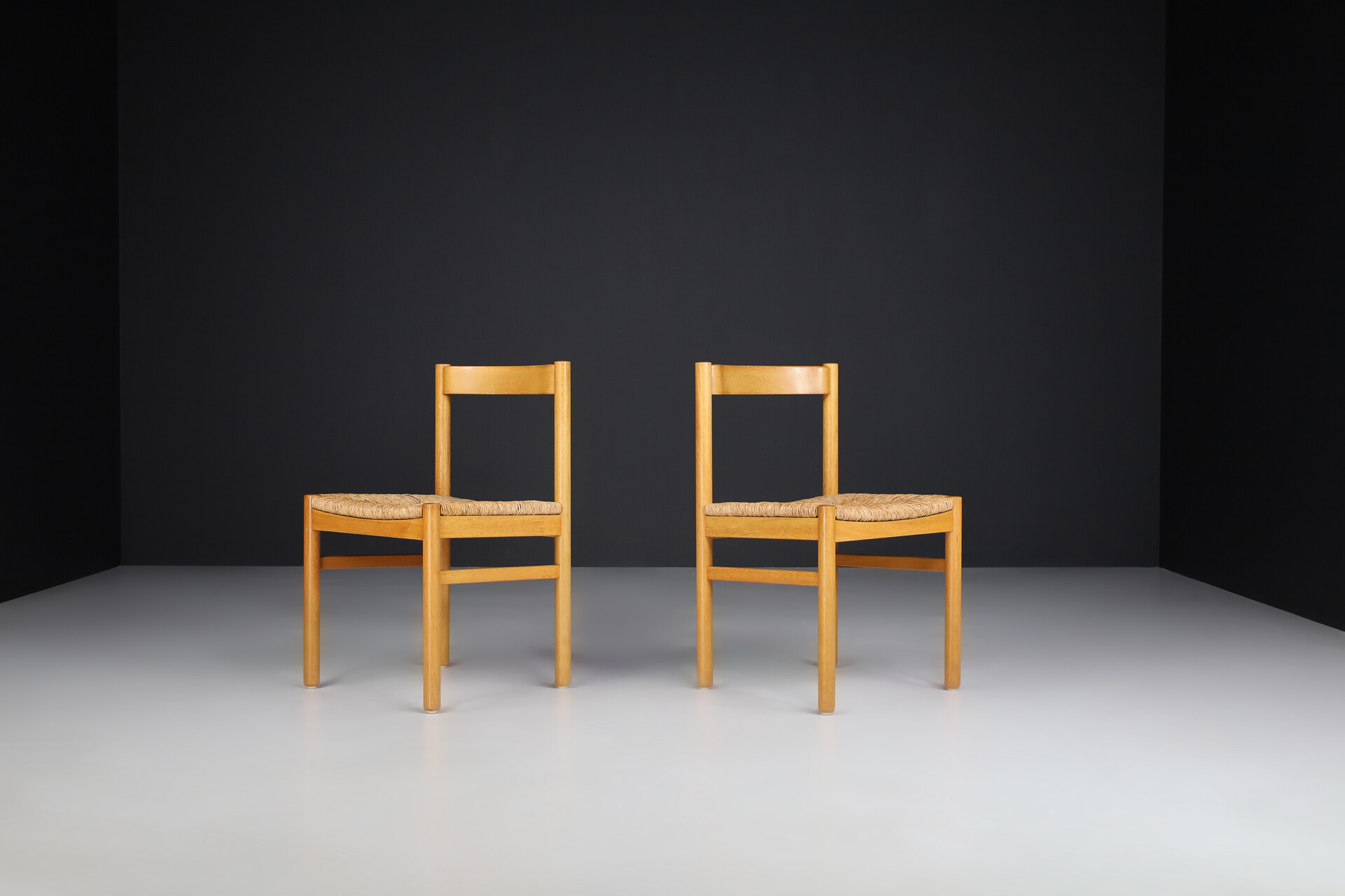 Mid century modern Beechwood and rush side chairs in the style of Charlotte Perriand , France 1960s Mid-20th century