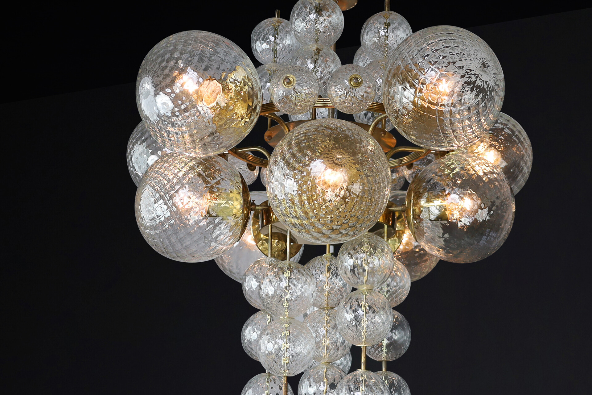 Mid century modern Chandelier with patinated brass fixture and hand-blowed glass globes by Preciosa Cz. Mid-20th century