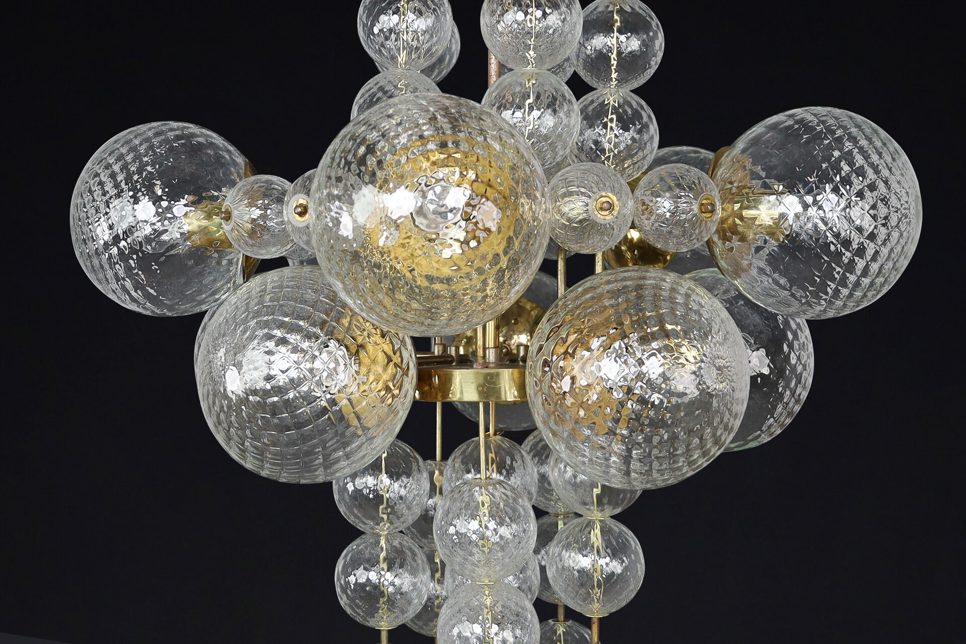 Mid century modern Chandelier with patinated brass fixture and hand-blowed glass globes by Preciosa Cz. Mid-20th century