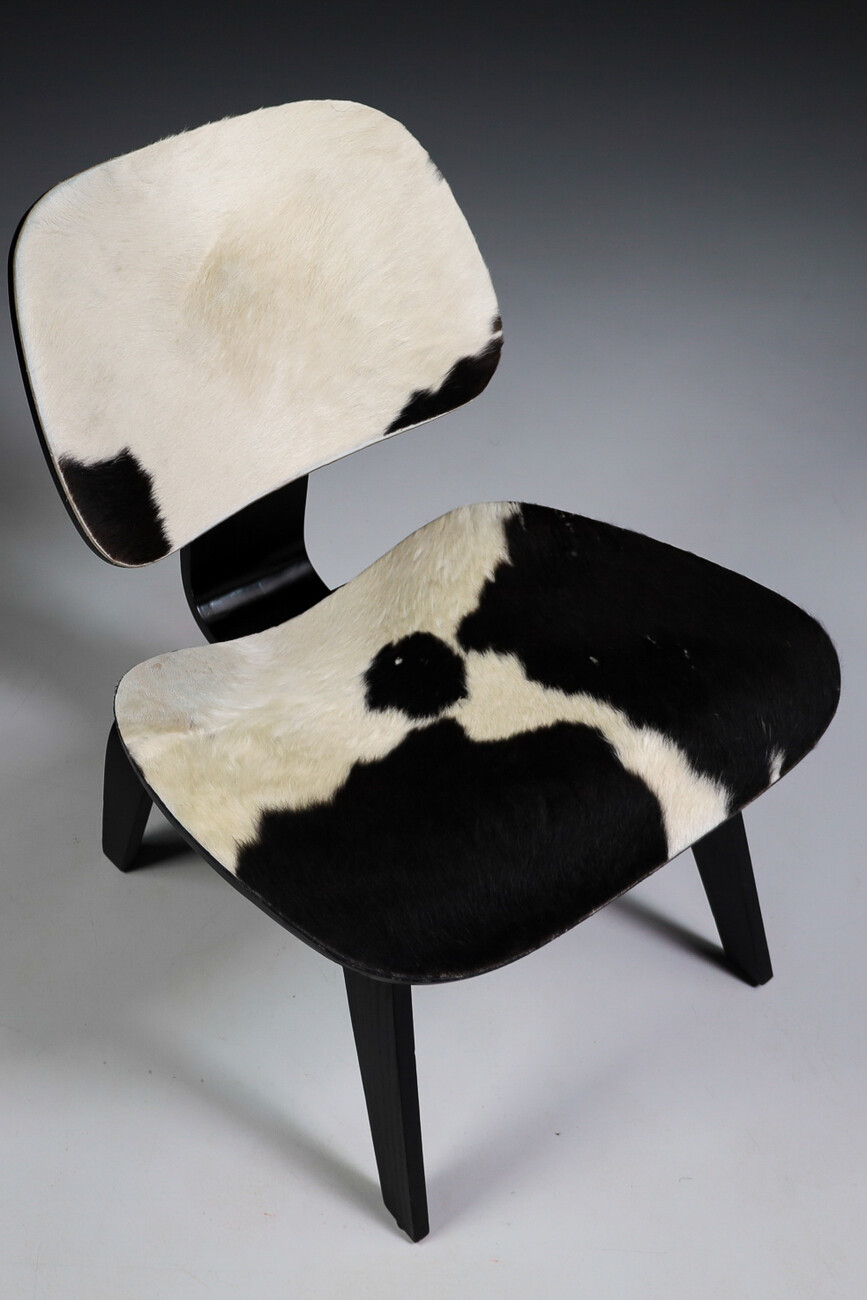 Mid century modern Charles & Ray Eames Design LCW Lounge Chair with black and withe cowhide Late-20th century