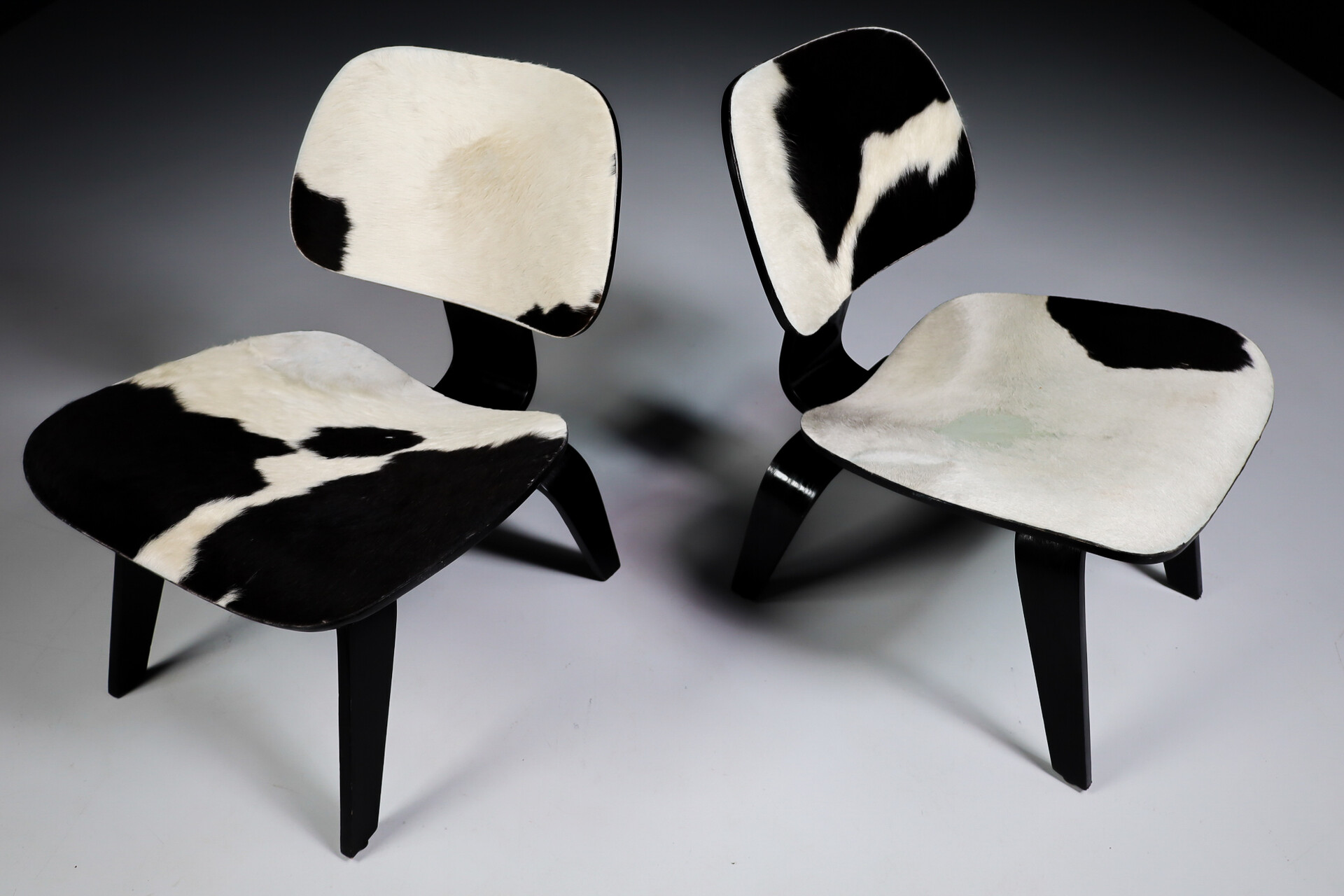 Mid century modern Charles & Ray Eames Design LCW Lounge Chair with black and withe cowhide Late-20th century