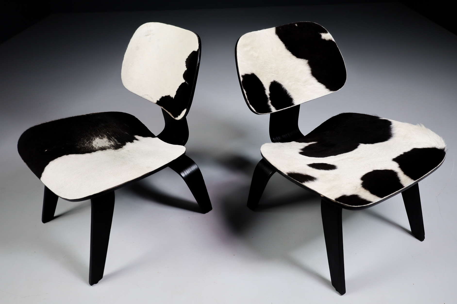 Mid century modern Charles & Ray Eames Design LCW Lounge Chair with black and withe cowhide Late-20th century