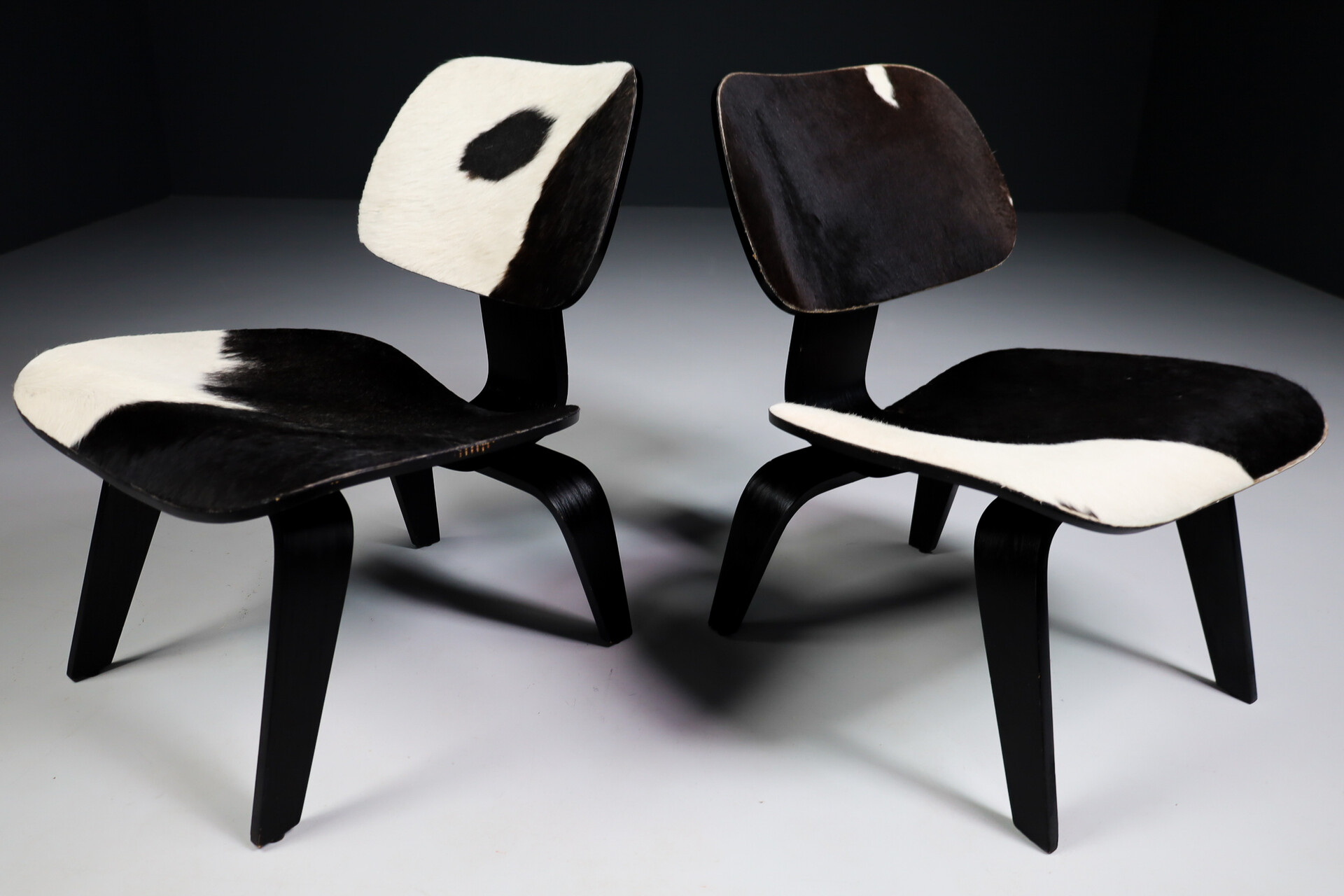 Mid century modern Charles & Ray Eames Design LCW Lounge Chair with black and withe cowhide Late-20th century