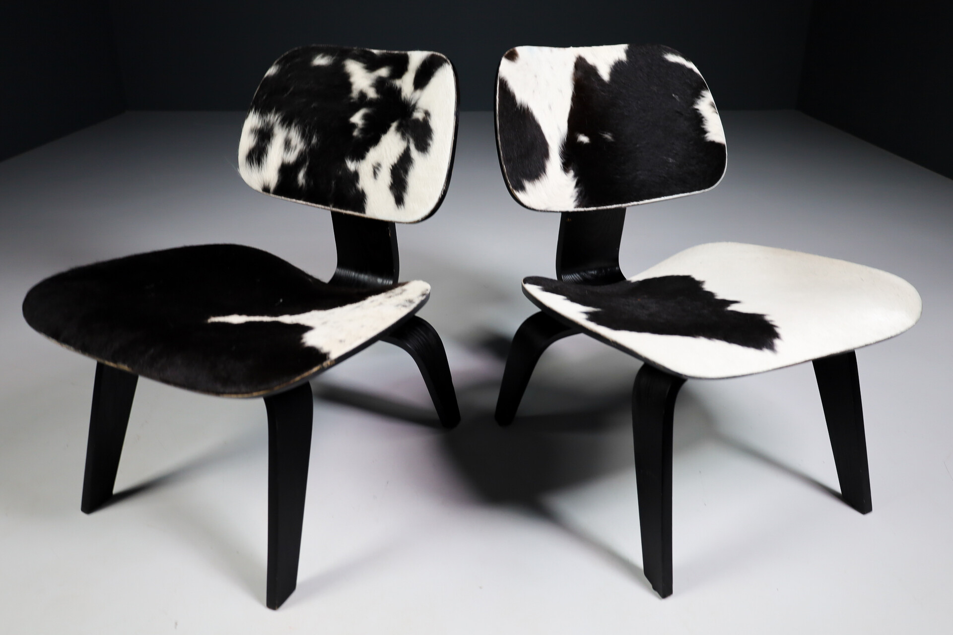 Mid century modern Charles & Ray Eames Design LCW Lounge Chair with black and withe cowhide Late-20th century