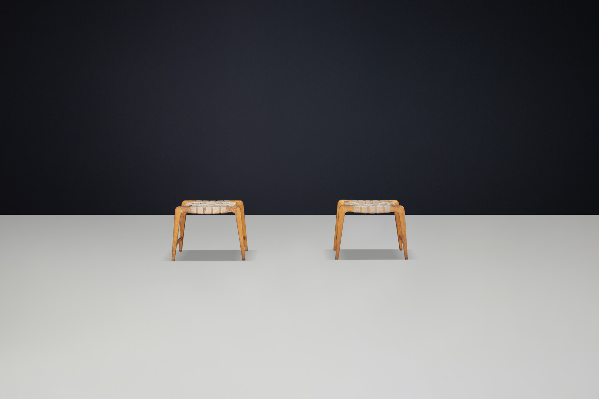 Mid century modern Jan Vanek sculptural set of two oak stools featuring woven canvas straps, 1940s Mid-20th century
