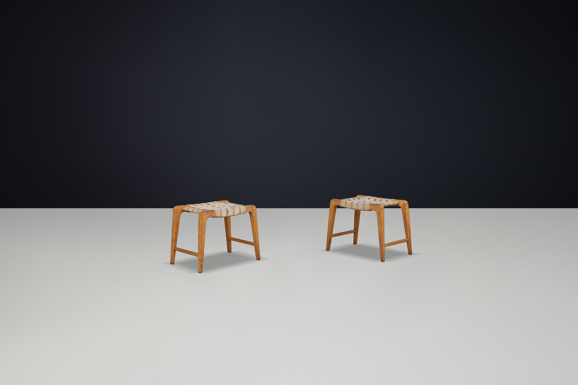 Mid century modern Jan Vanek sculptural set of two oak stools featuring woven canvas straps, 1940s Mid-20th century