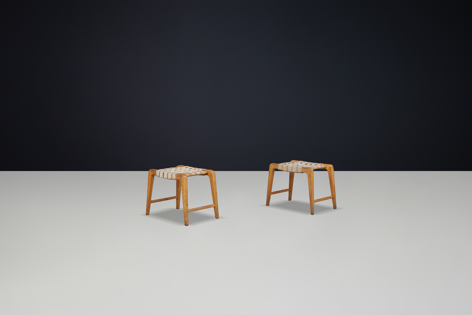 Mid century modern Jan Vanek sculptural set of two oak stools featuring woven canvas straps, 1940s Mid-20th century