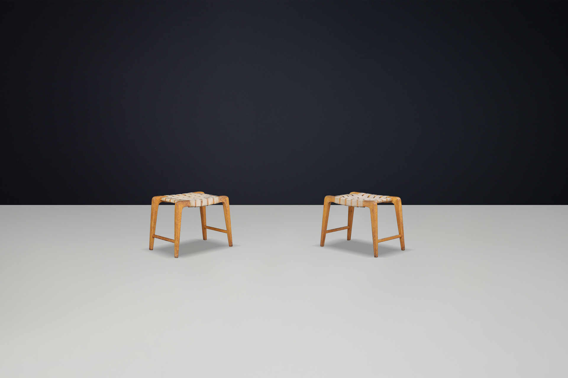 Mid century modern Jan Vanek sculptural set of two oak stools featuring woven canvas straps, 1940s Mid-20th century