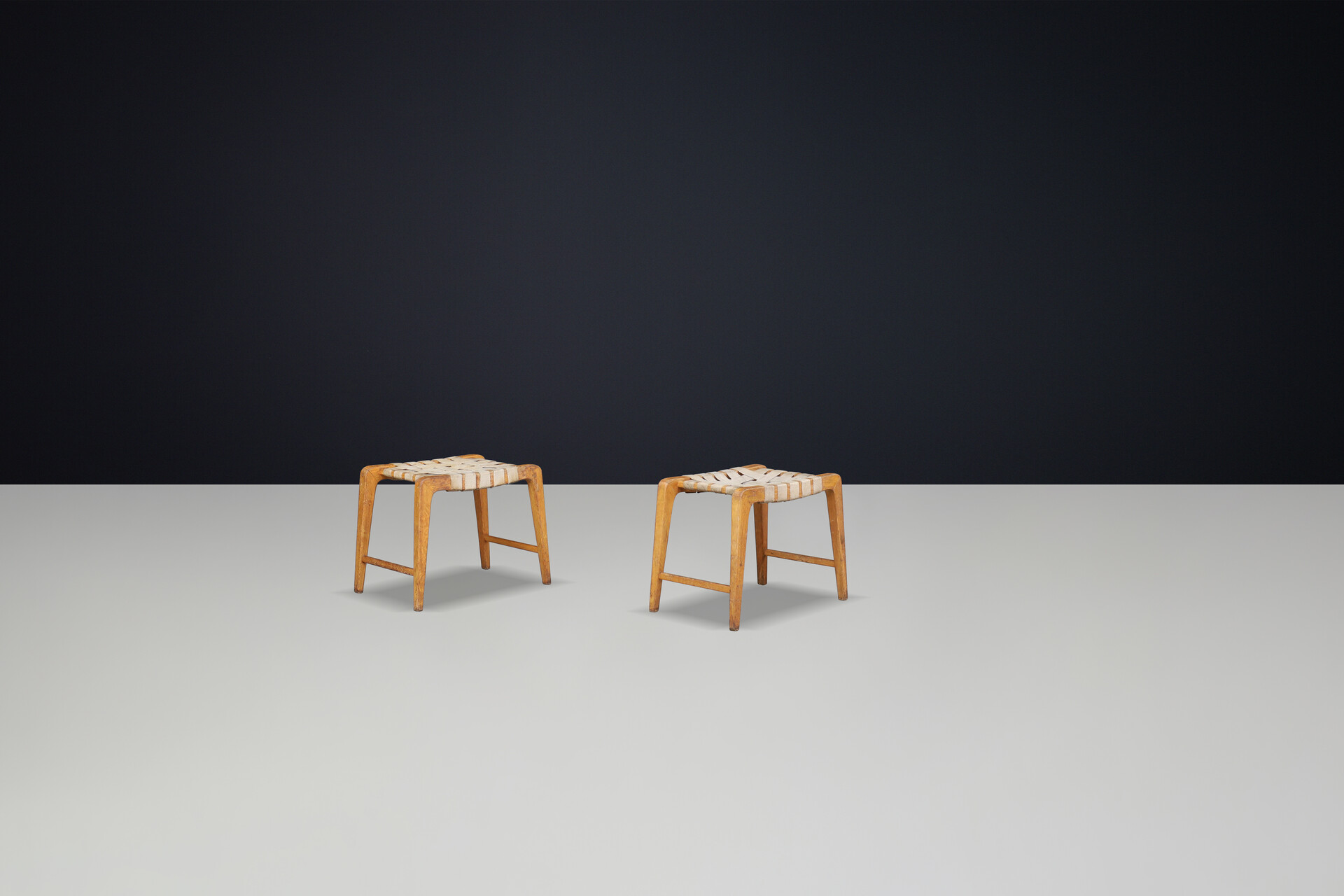 Mid century modern Jan Vanek sculptural set of two oak stools featuring woven canvas straps, 1940s Mid-20th century