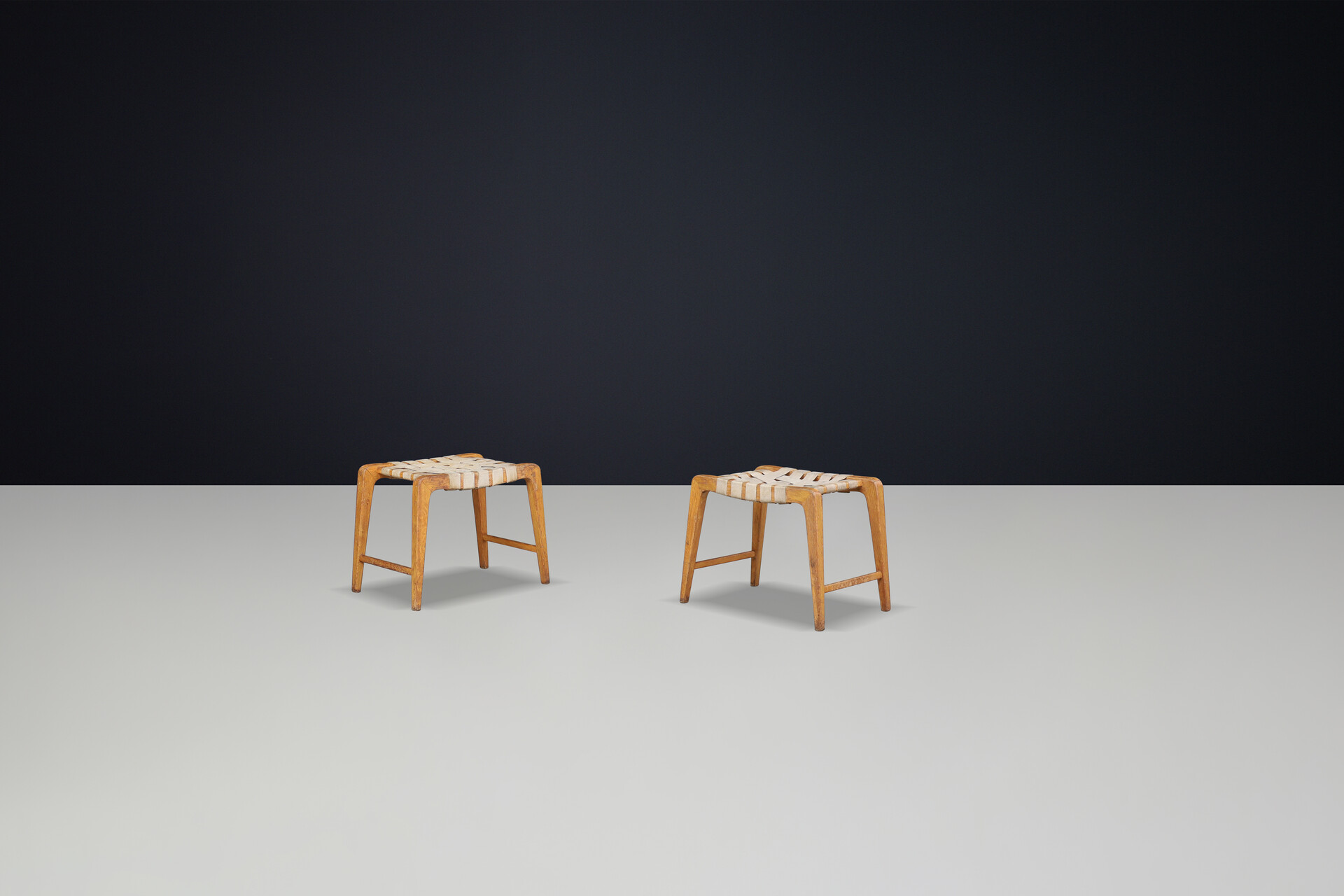 Mid century modern Jan Vanek sculptural set of two oak stools featuring woven canvas straps, 1940s Mid-20th century