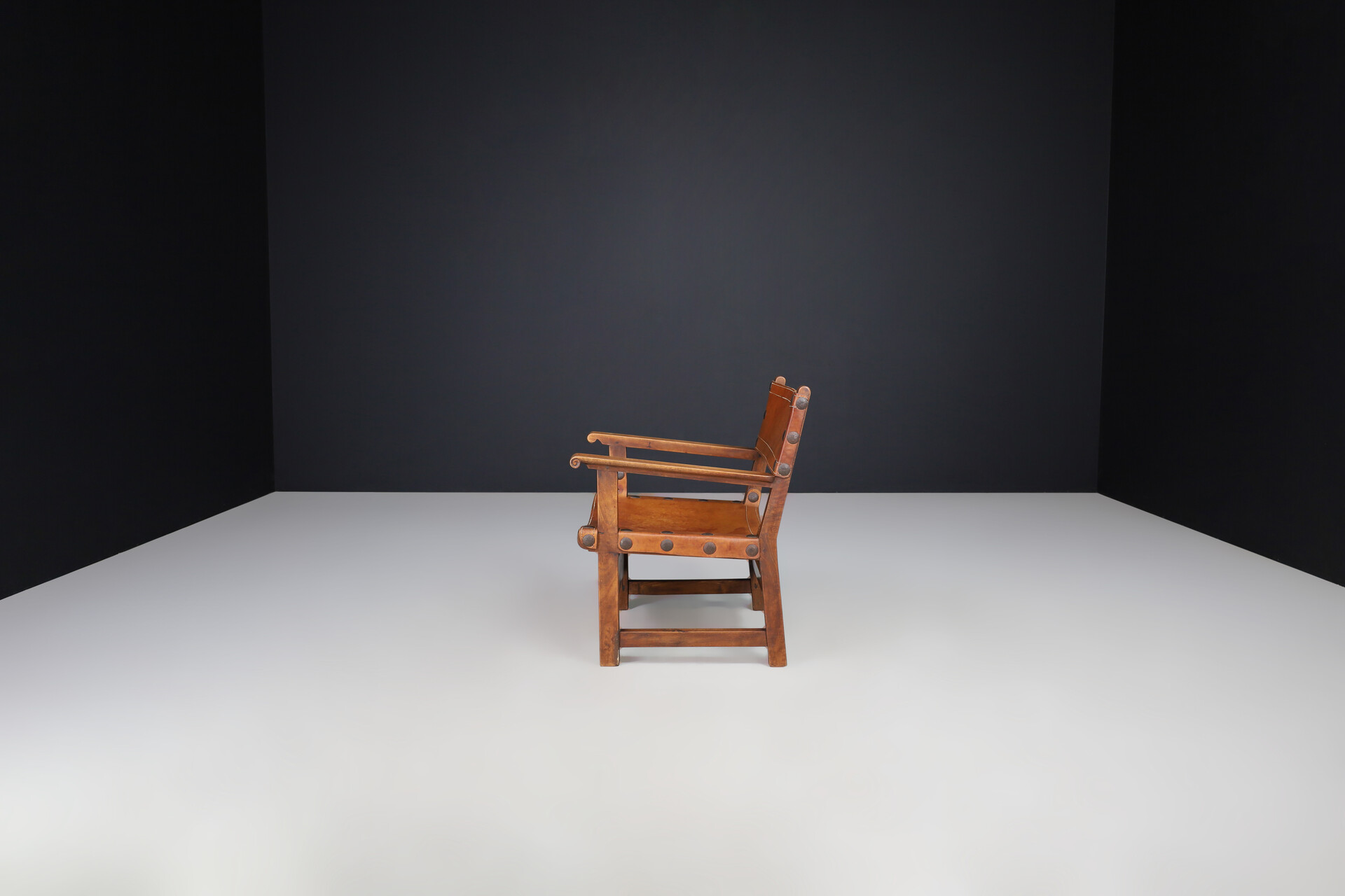 Mid century modern Patinated cognac leather and wood lounge chair, France 1960s Mid-20th century