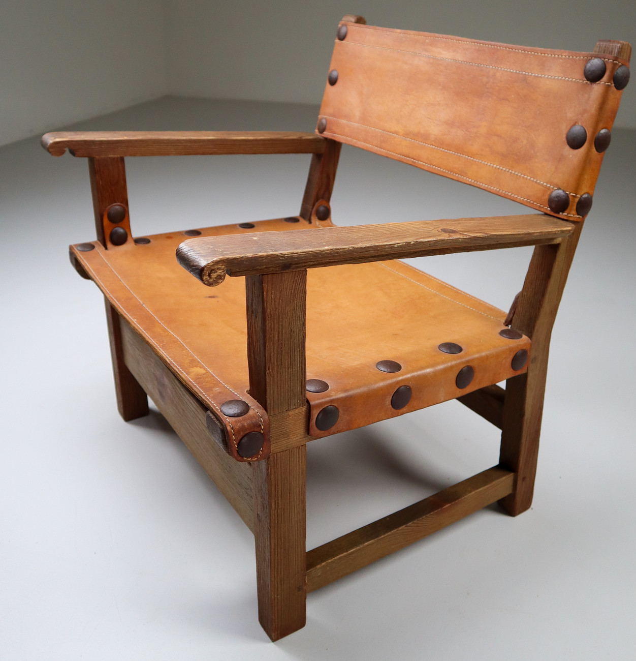 Midcentury French Lounge Chair in Patinated Cognac Saddle Leather, 1950s Mid-20th century