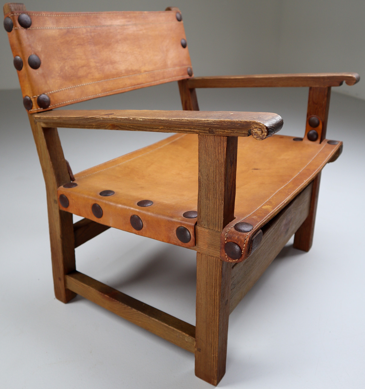 Midcentury French Lounge Chair in Patinated Cognac Saddle Leather, 1950s Mid-20th century