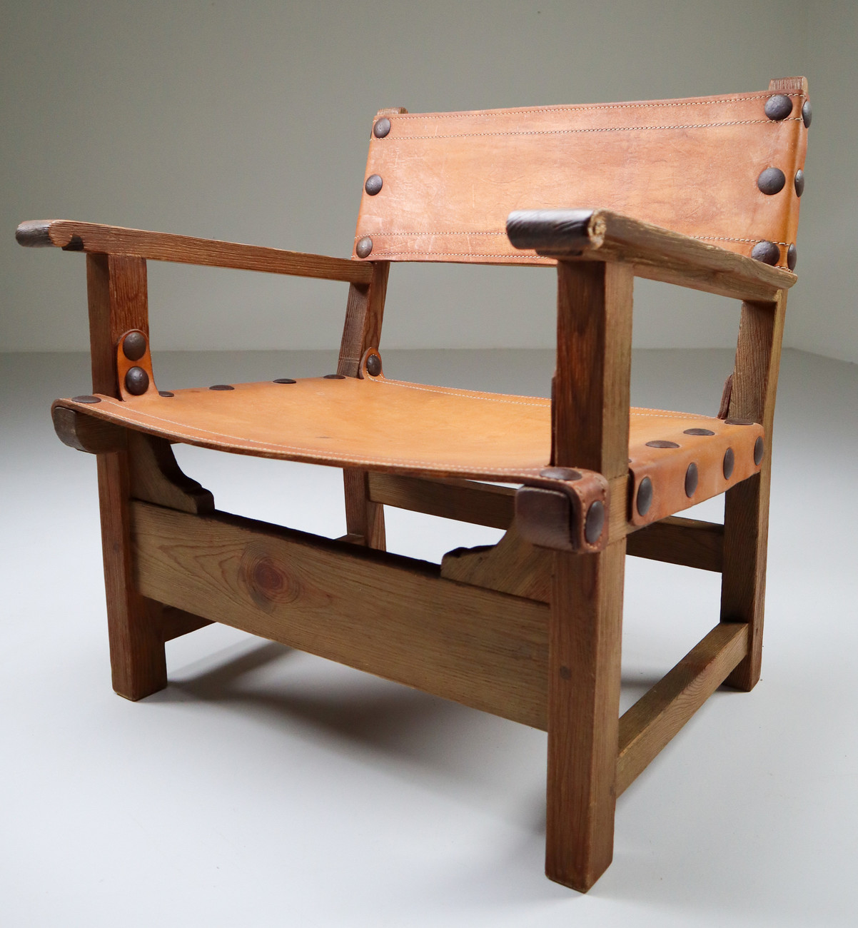 Midcentury French Lounge Chair in Patinated Cognac Saddle Leather, 1950s Mid-20th century