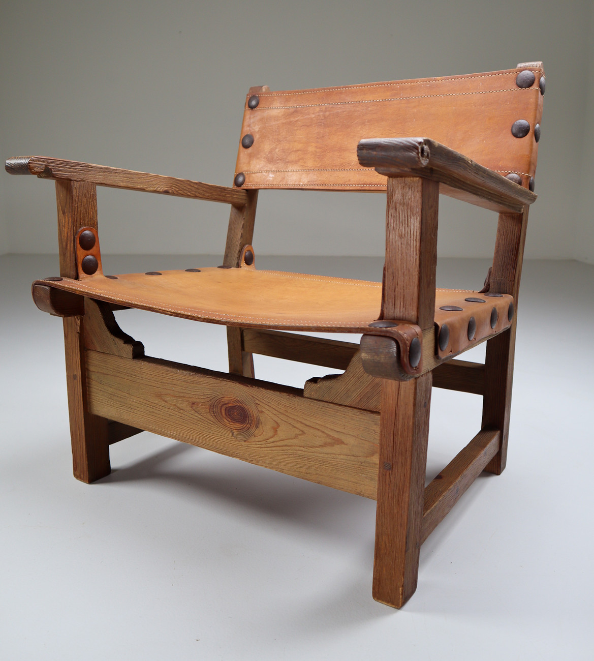 Midcentury French Lounge Chair in Patinated Cognac Saddle Leather, 1950s Mid-20th century