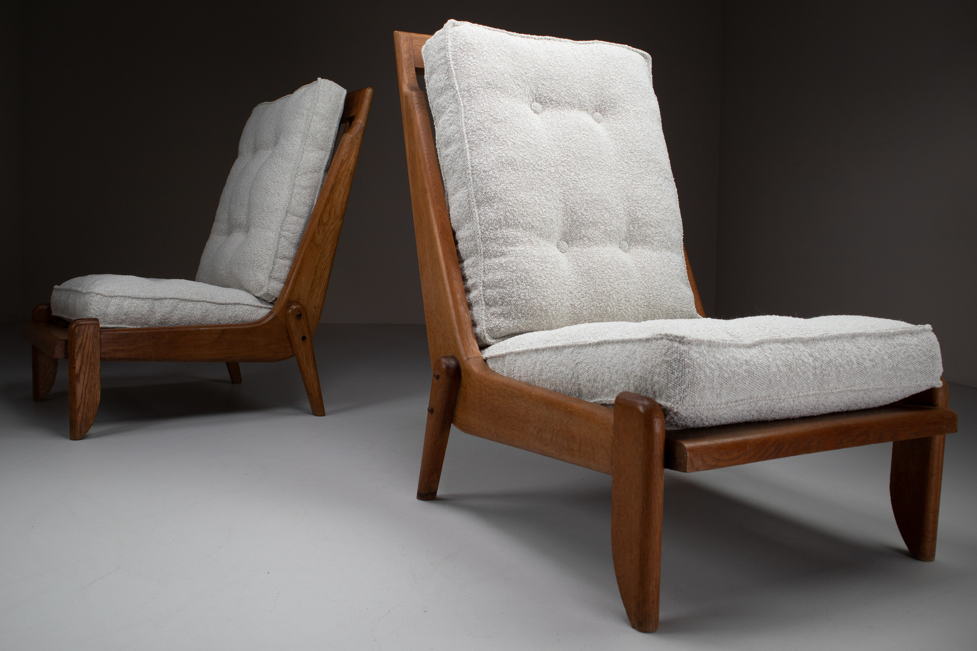 Pair Oak Lounge chairs by Guillerme & Chambron with newly upholstered cushions in boucle fabric , France, circa 1950 Mid-20th century