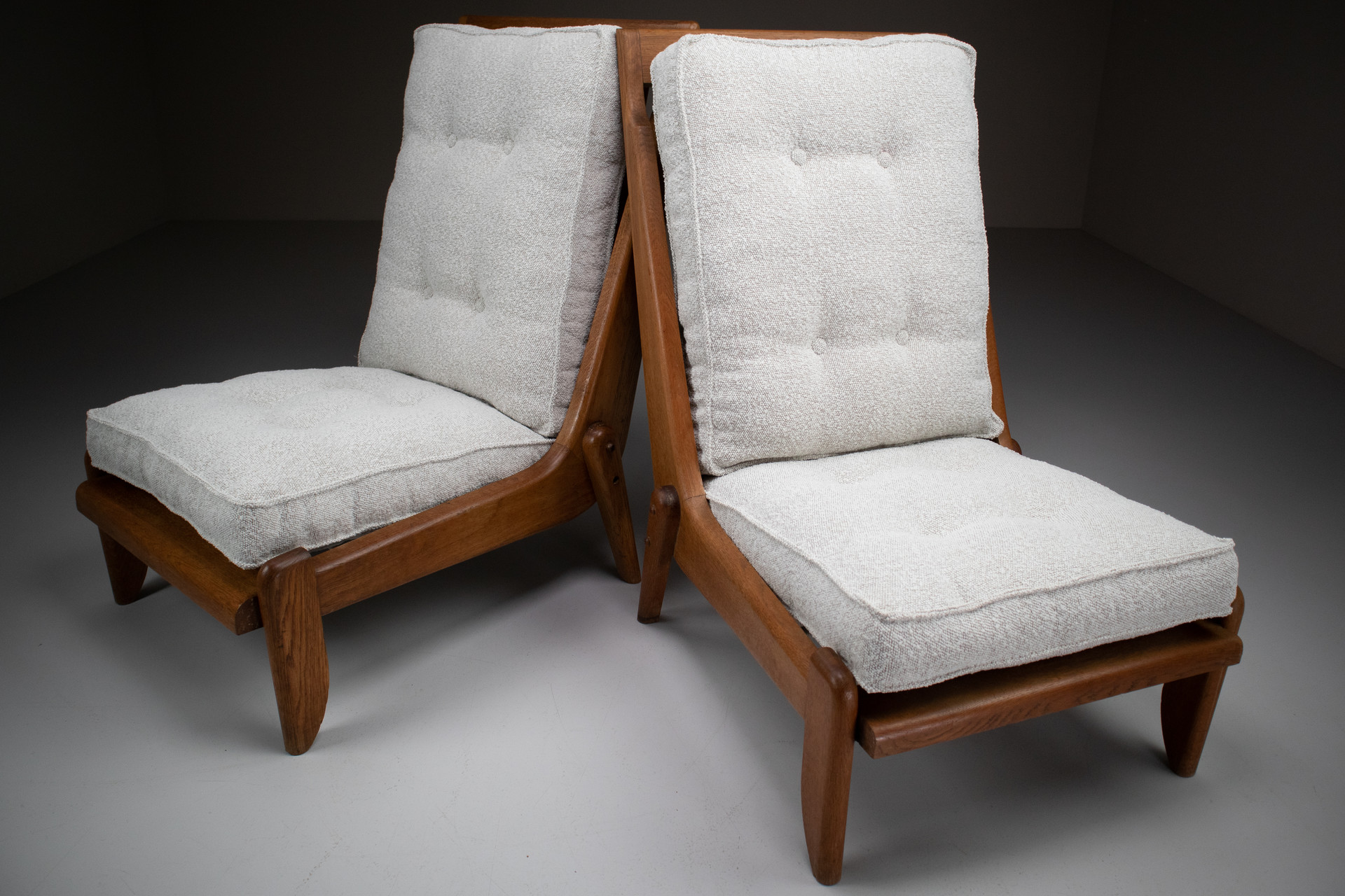 Pair Oak Lounge chairs by Guillerme & Chambron with newly upholstered cushions in boucle fabric , France, circa 1950 Mid-20th century