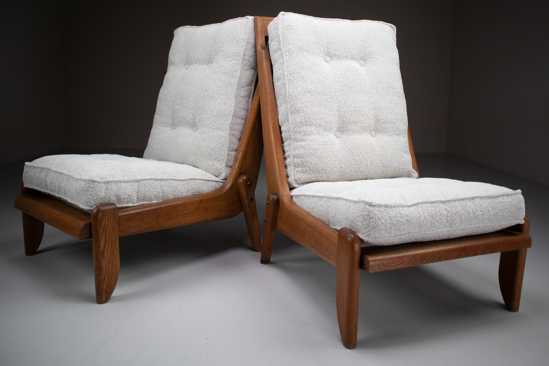 Pair Oak Lounge chairs by Guillerme & Chambron with newly upholstered cushions in boucle fabric , France, circa 1950 Mid-20th century